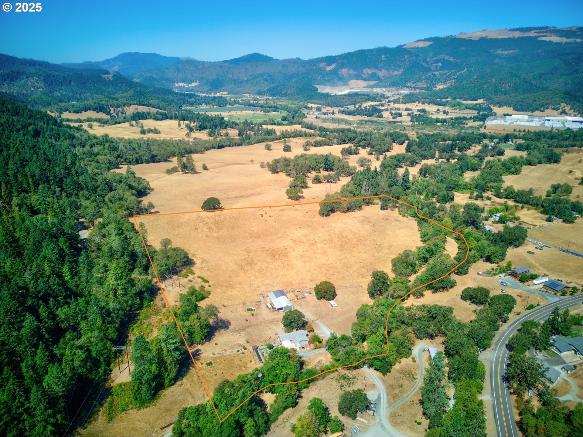 187 Hackett Lane Riddle, OR 97469 - Photo 45 of 48 a view of a lake with mountains in the background