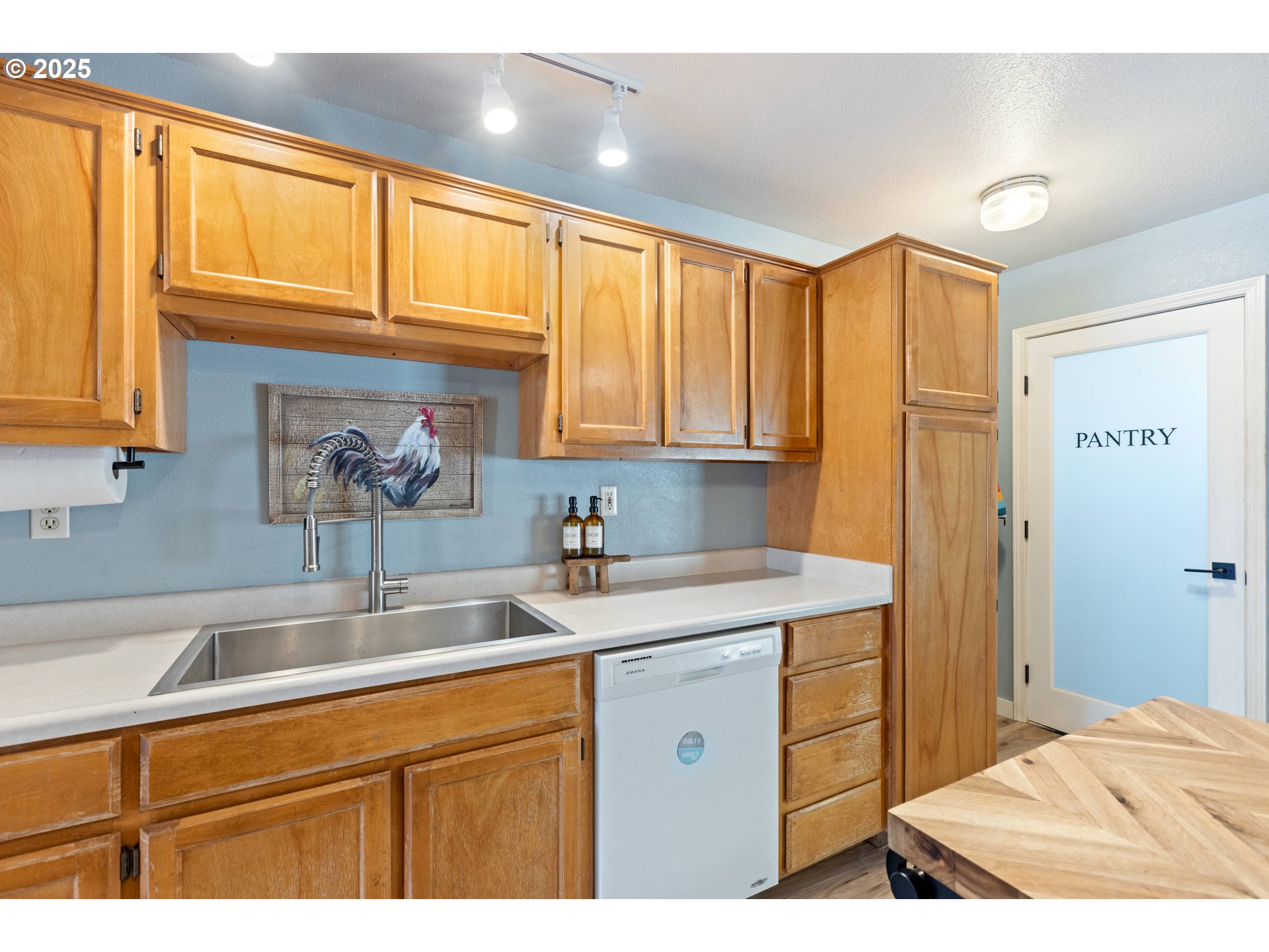 187 Hackett Lane Riddle, OR 97469 - Photo 9 of 48 a kitchen with a sink cabinets and a window