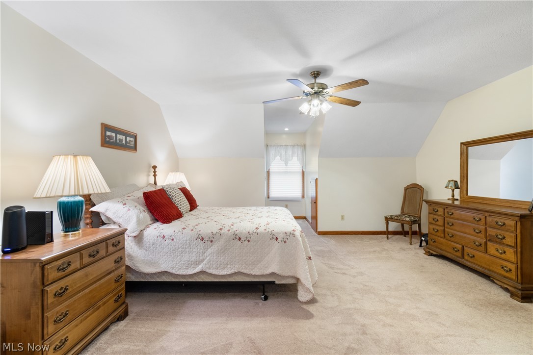 5212 Gray Road Ravenna, OH 44266 - Photo 17 of 37 Upstairs Bedroom with light carpet, and ceiling fan