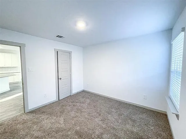 an empty room with a natural light