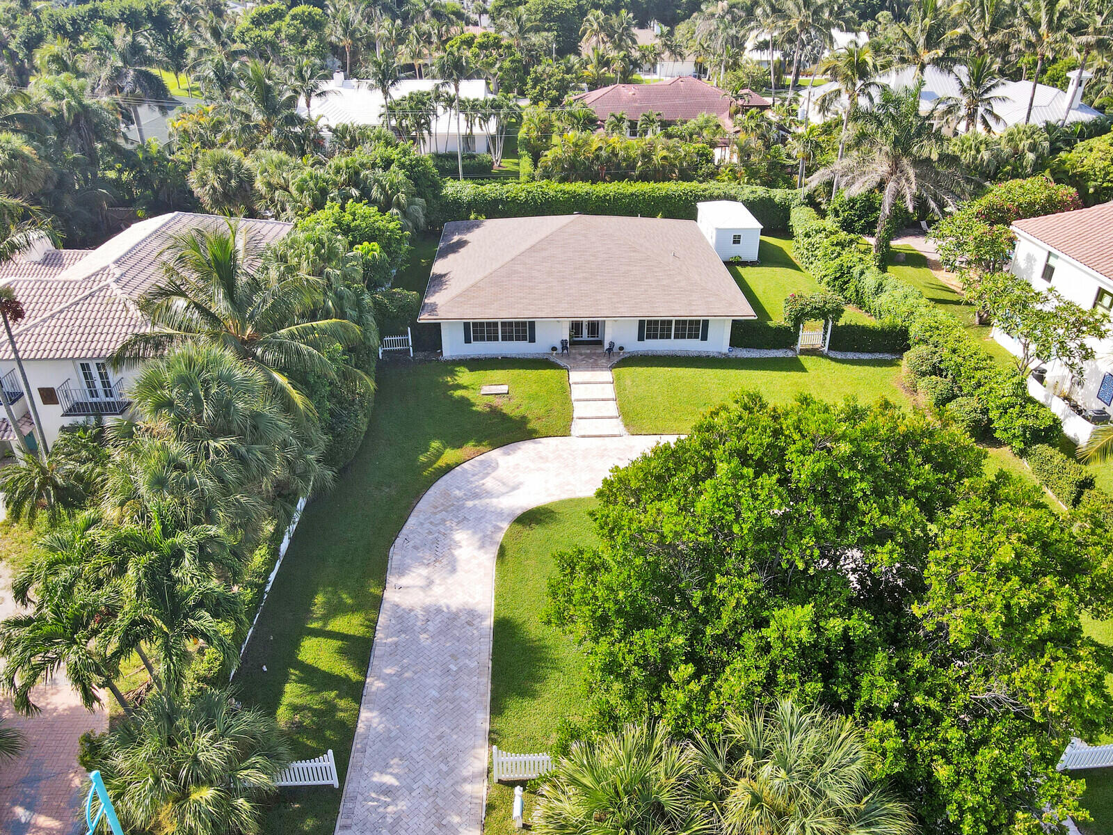 an aerial view of a house with swimming pool outdoor seating and yard