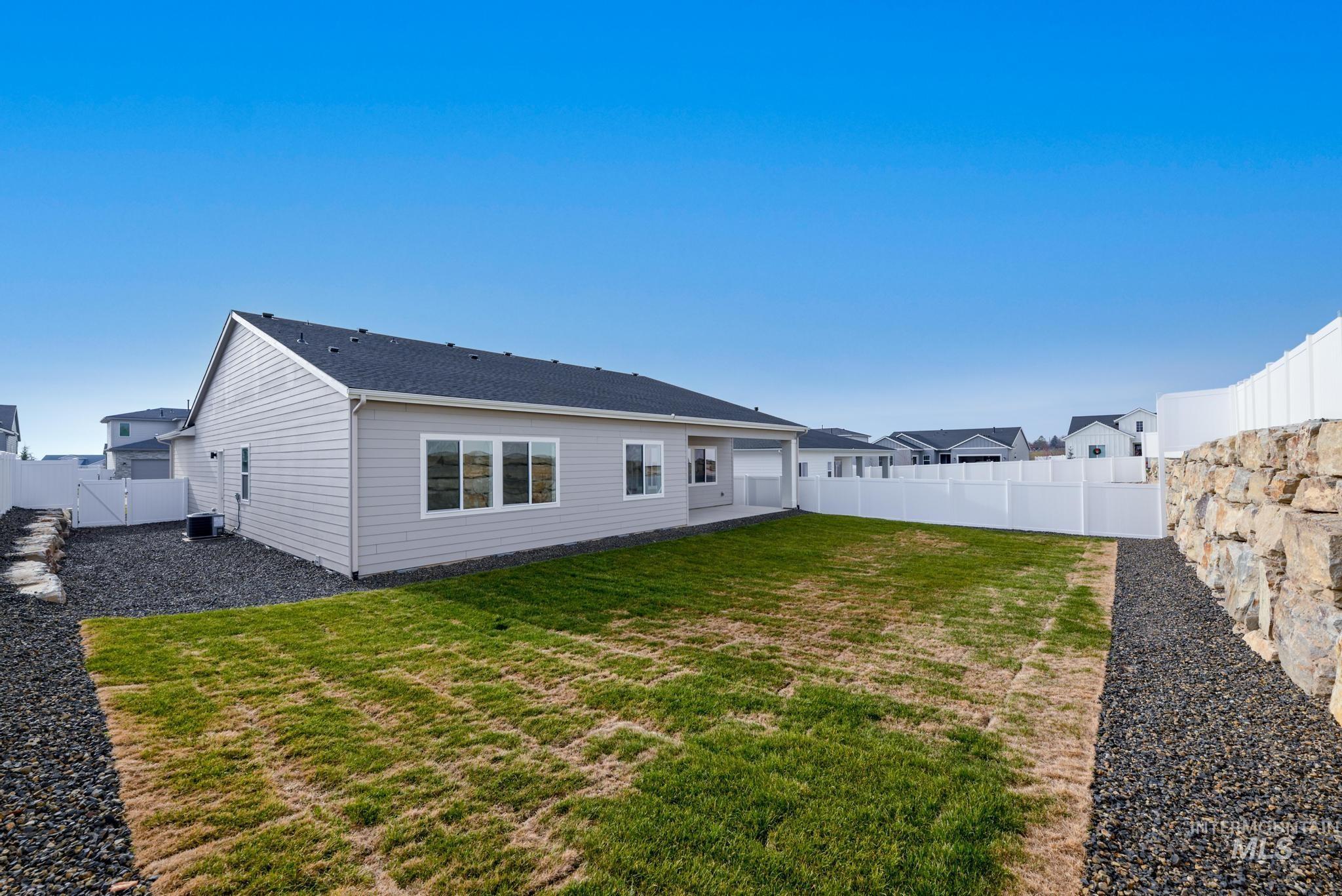 14702 Port Royal Street Caldwell, ID 83607 - Photo 29 of 39 Rear view of property with a fenced backyard, a patio area, and a gate