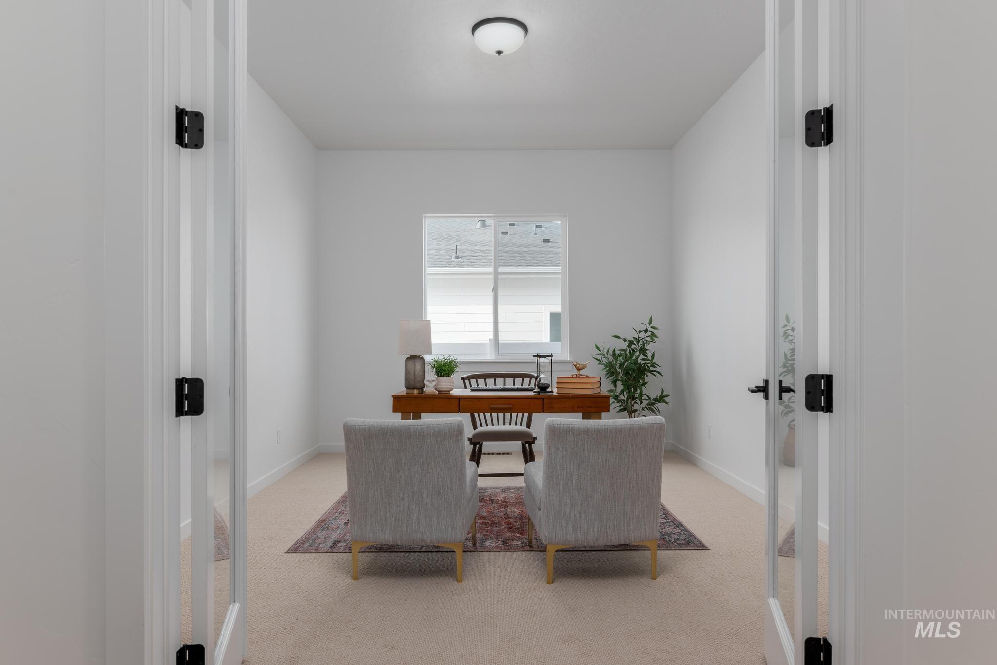 14702 Port Royal Street Caldwell, ID 83607 - Photo 4 of 39 Dining space with a desk, light carpet, and french doors
