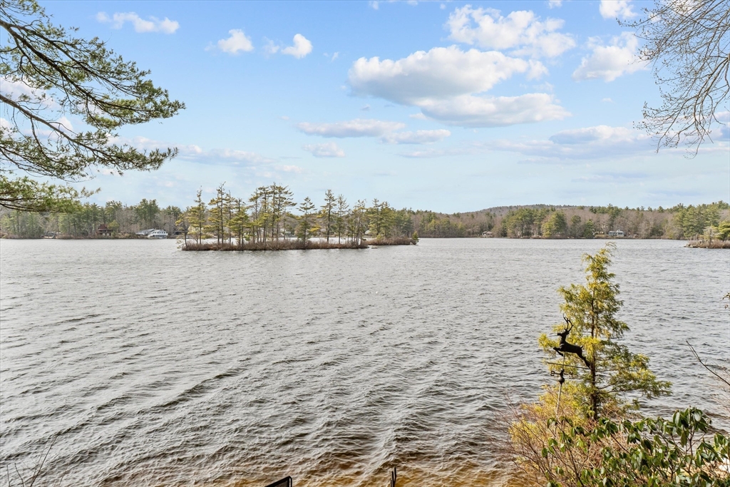 110 Stodge Meadow Road Ashburnham, MA 01430 - Photo 1 of 27 a view of a lake with houses in the back
