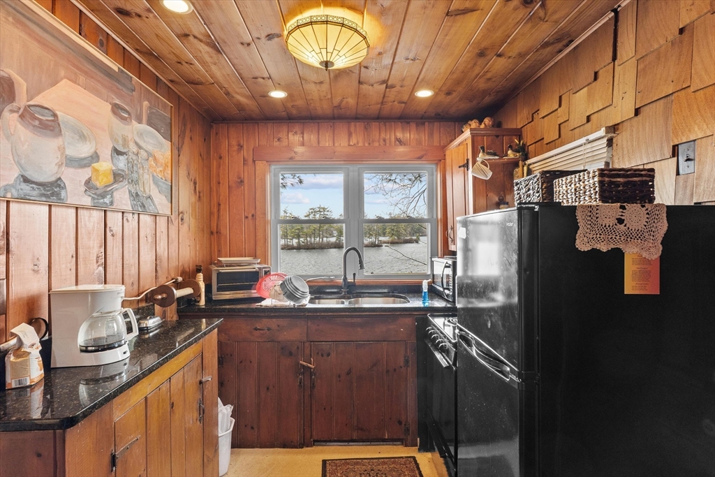 110 Stodge Meadow Road Ashburnham, MA 01430 - Photo 11 of 27 a kitchen with a sink and a refrigerator
