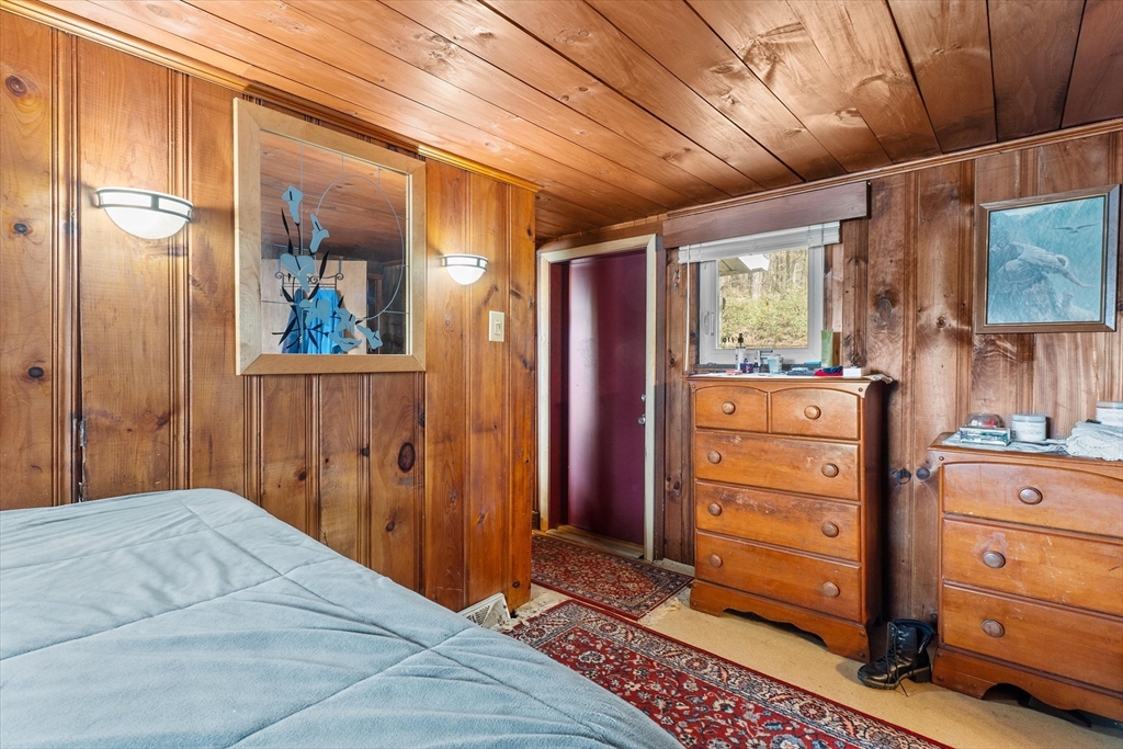 110 Stodge Meadow Road Ashburnham, MA 01430 - Photo 13 of 27 a bedroom with a bed and a dresser