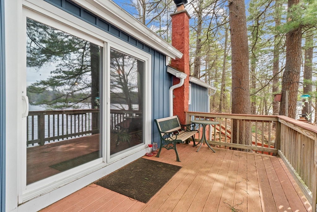 110 Stodge Meadow Road Ashburnham, MA 01430 - Photo 16 of 27 a view of a balcony with chairs and wooden fence