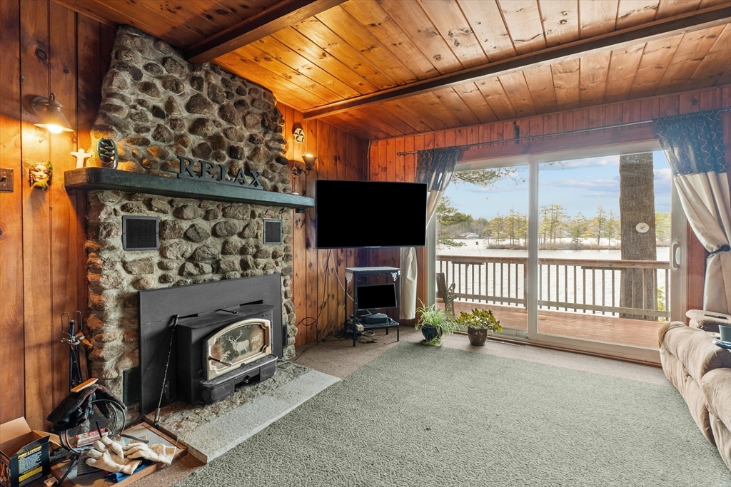 110 Stodge Meadow Road Ashburnham, MA 01430 - Photo 4 of 27 a view of a livingroom with furniture and a fireplace