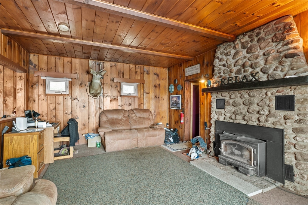 110 Stodge Meadow Road Ashburnham, MA 01430 - Photo 6 of 27 a living room with furniture and a fireplace