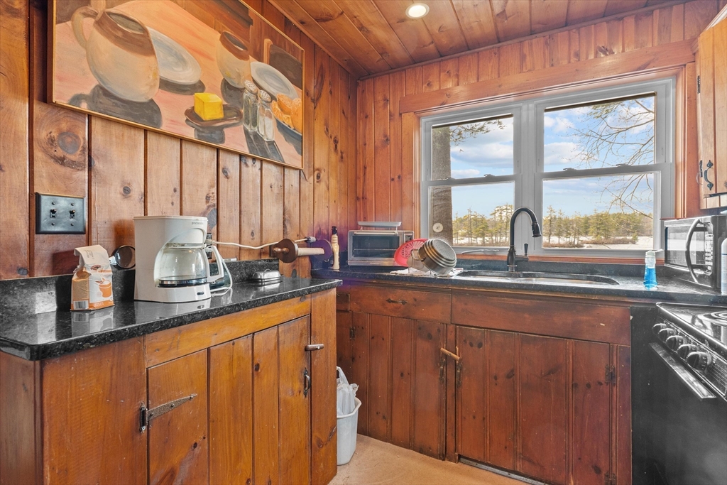 110 Stodge Meadow Road Ashburnham, MA 01430 - Photo 9 of 27 a kitchen with sink a window and cabinets