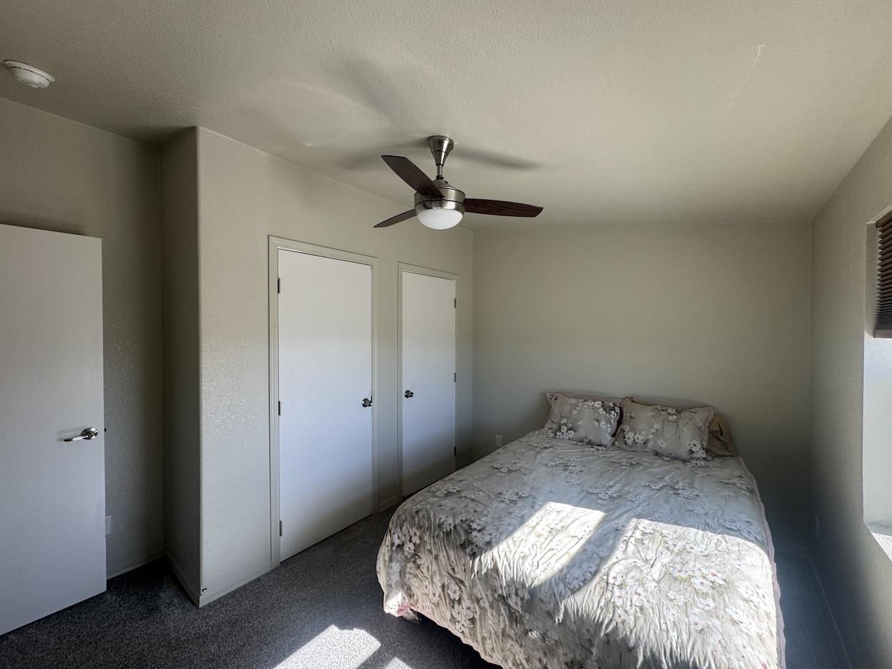 352 Wofford Road, Unit 4 Bishop, CA 93514 - Photo 21 of 40 Bedroom with carpet, ceiling fan, and a textured ceiling