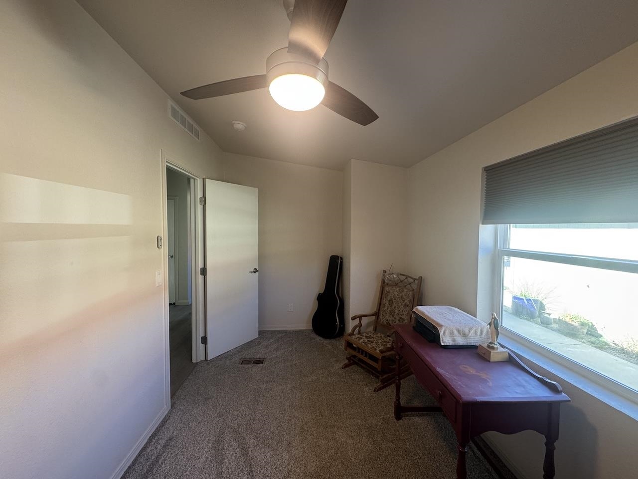 352 Wofford Road, Unit 4 Bishop, CA 93514 - Photo 23 of 40 Living area featuring carpet floors and ceiling fan