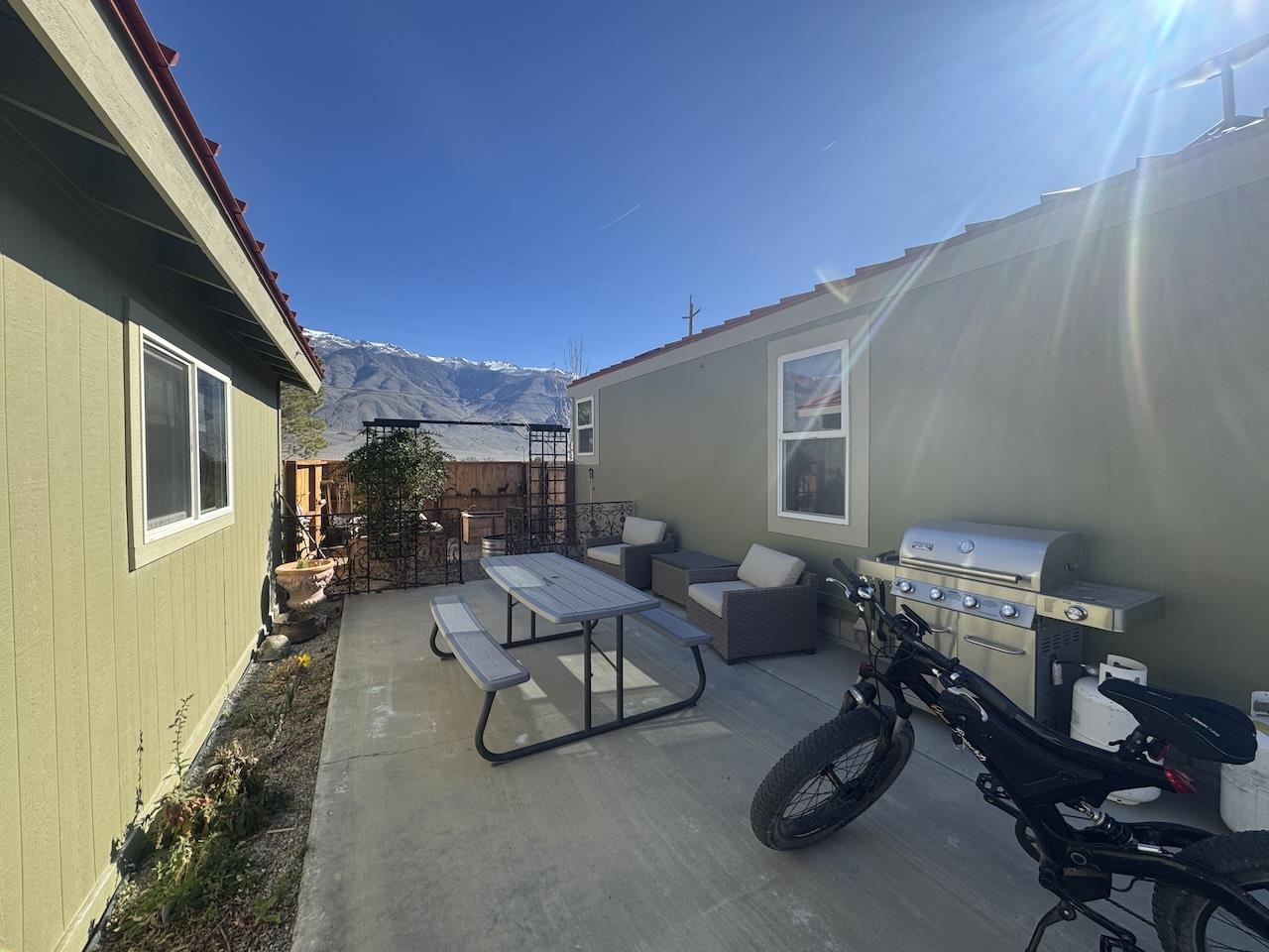 352 Wofford Road, Unit 4 Bishop, CA 93514 - Photo 25 of 40 View of patio featuring outdoor lounge area, a mountain view, and a grill