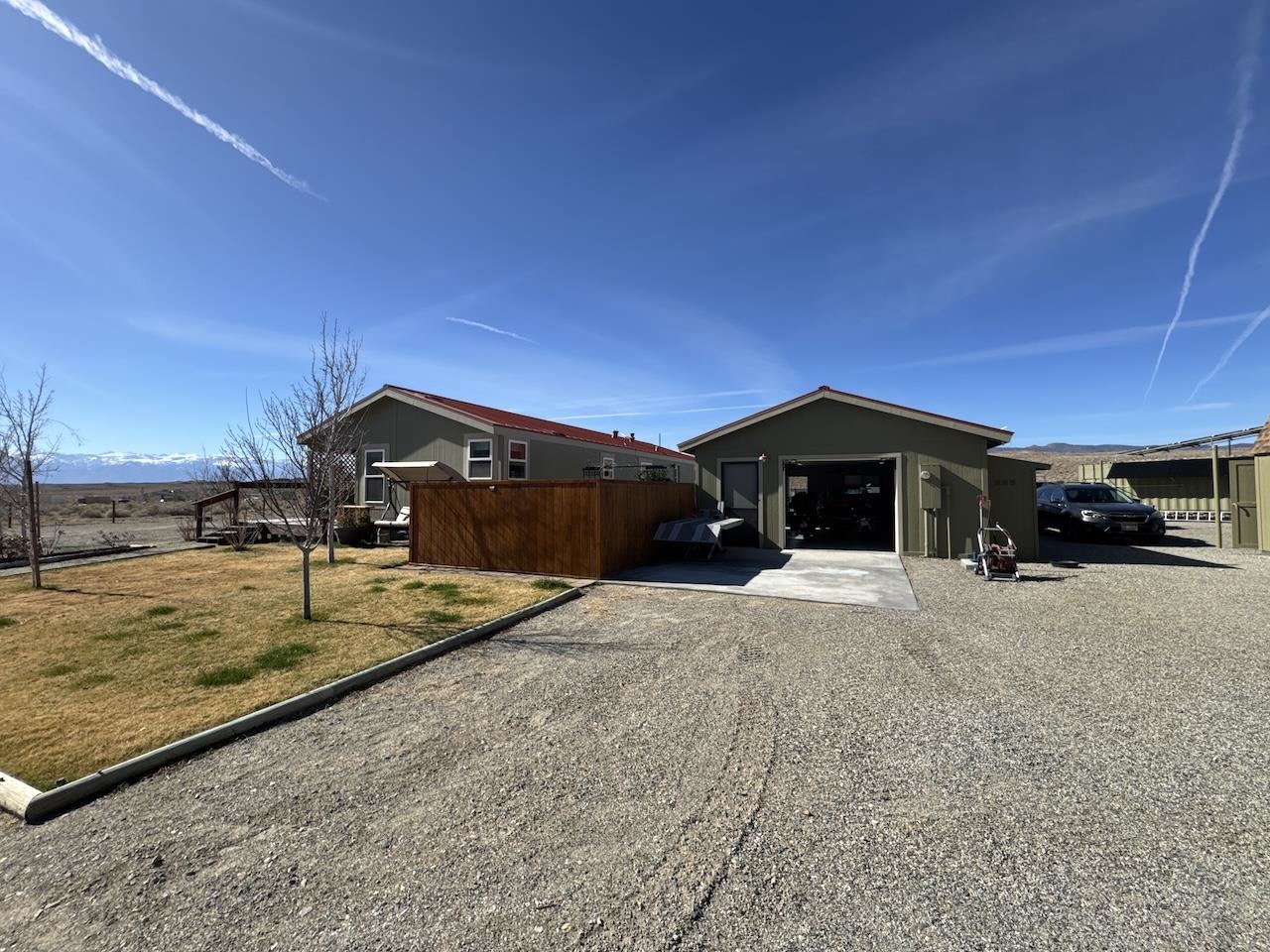 352 Wofford Road, Unit 4 Bishop, CA 93514 - Photo 28 of 40 View of property exterior featuring driveway, an outbuilding, and a garage