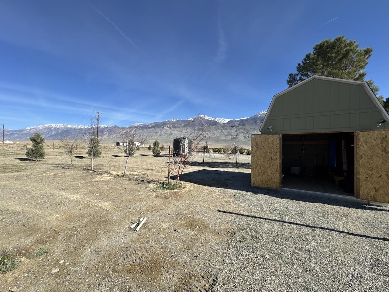 352 Wofford Road, Unit 4 Bishop, CA 93514 - Photo 33 of 40 View of yard with an outbuilding, a mountain view, and a view of rural / pastoral area