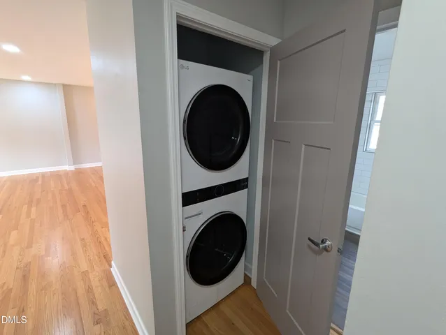 a view of a hallway with washer and dryer