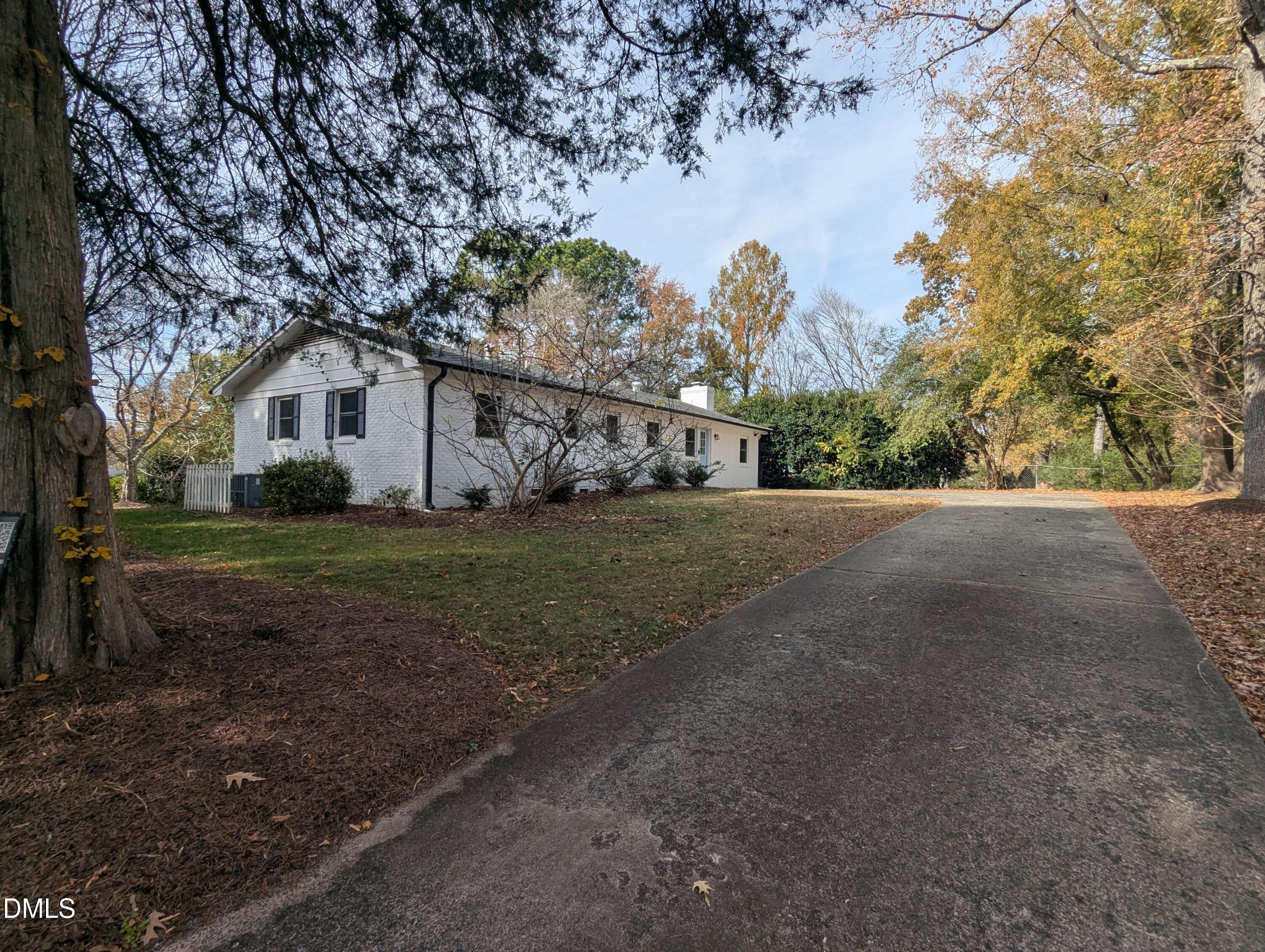 4011 Garrett Road Durham, NC 27707 - Photo 3 of 21 a view of house with a yard