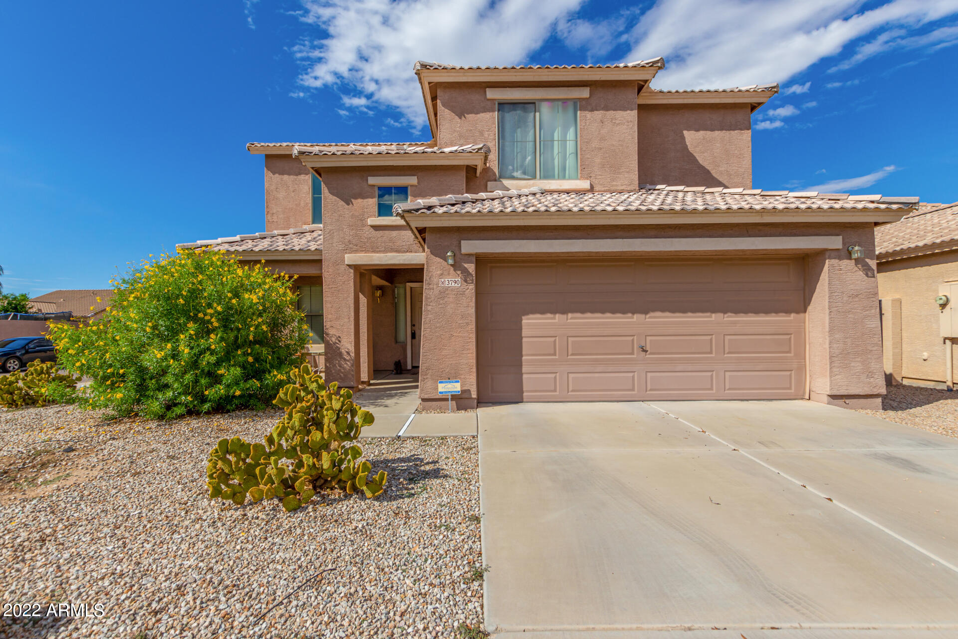 3790 West South Butte Road Queen Creek, AZ 85144 - Photo 1 of 40 a front view of a house with a garden