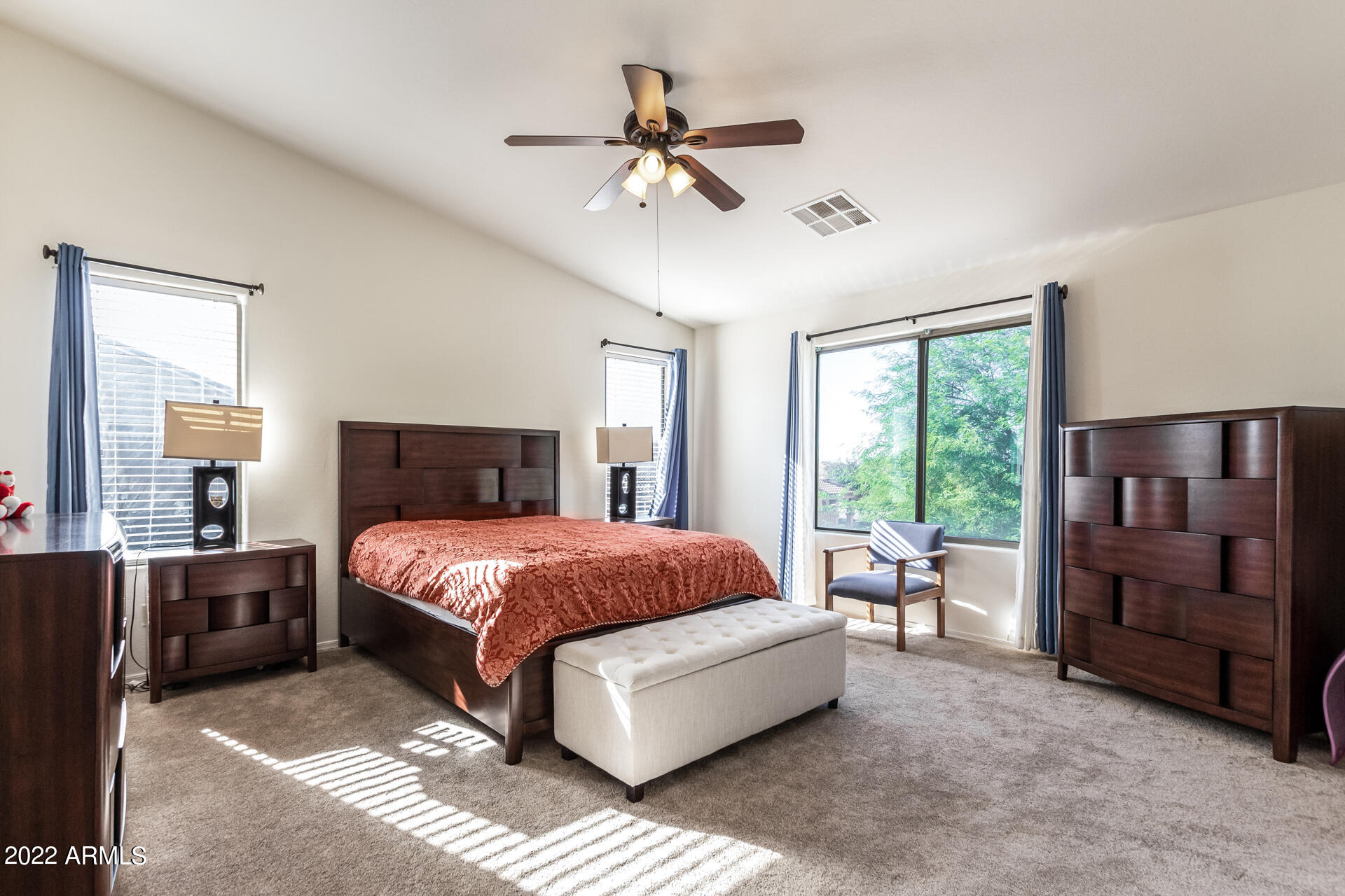 3790 West South Butte Road Queen Creek, AZ 85144 - Photo 17 of 40 a spacious bedroom with a bed and a window