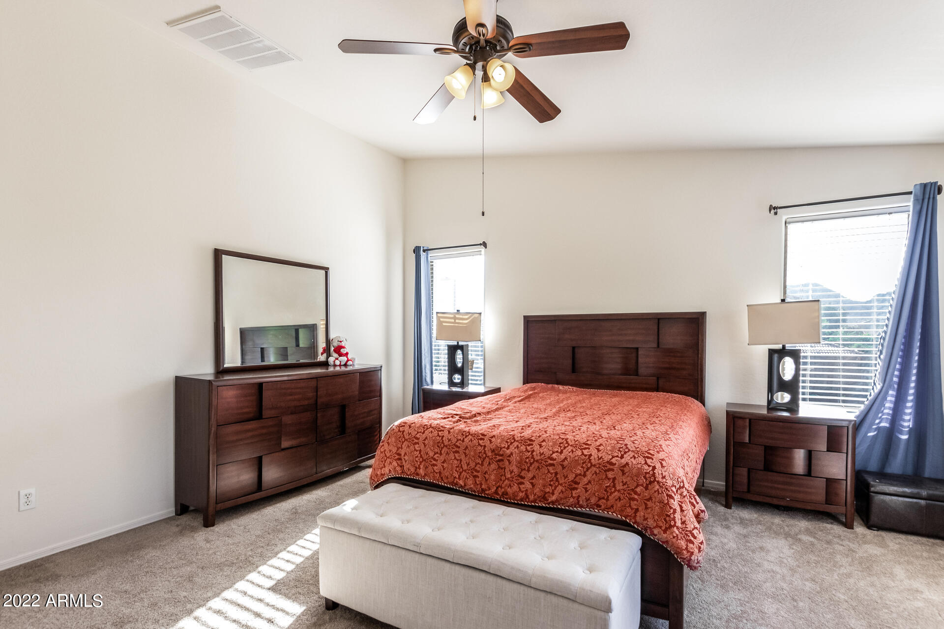 3790 West South Butte Road Queen Creek, AZ 85144 - Photo 19 of 40 a bedroom with a bed and wooden floor