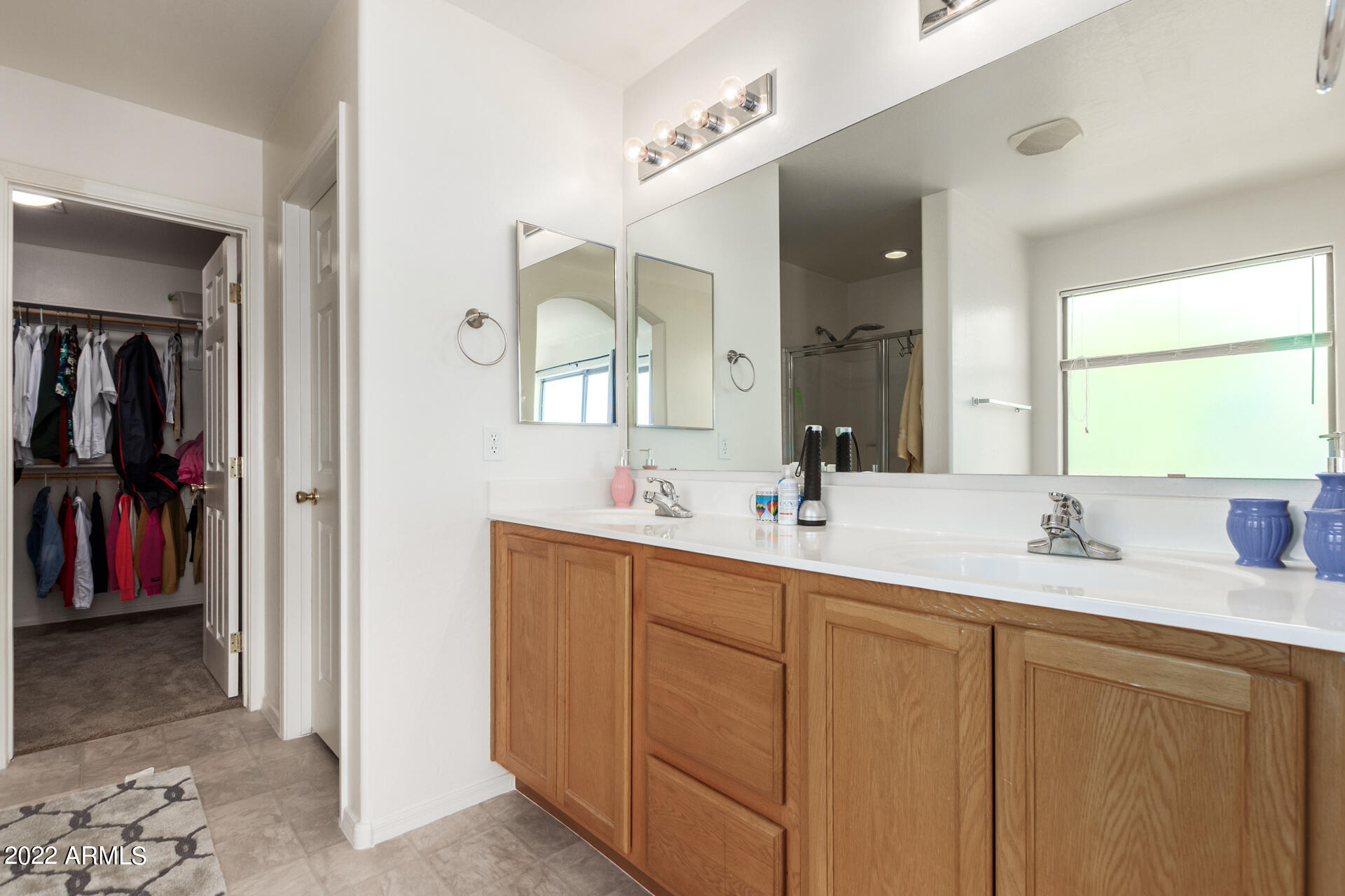 3790 West South Butte Road Queen Creek, AZ 85144 - Photo 21 of 40 a en suite bathroom with double sink and a mirror