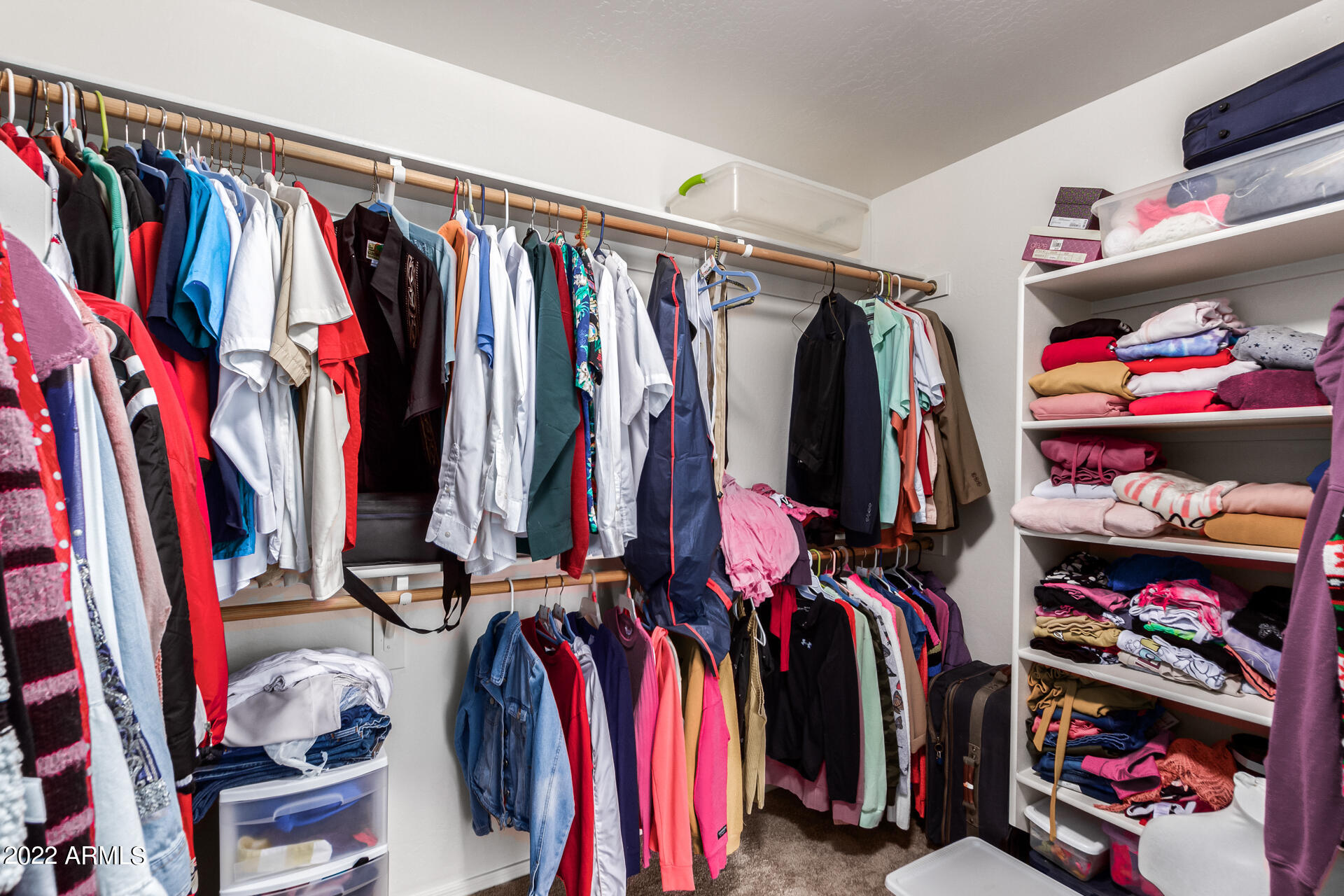 3790 West South Butte Road Queen Creek, AZ 85144 - Photo 24 of 40 a view of walk in closet with clothes and shoes