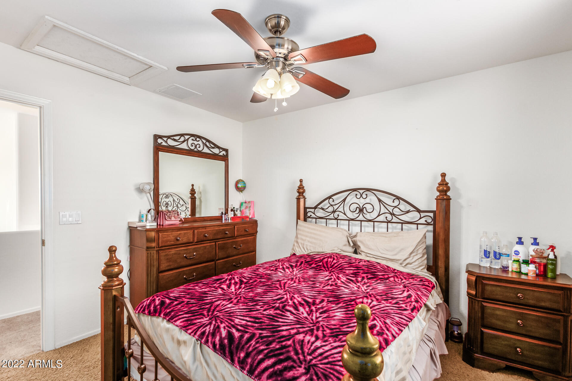 3790 West South Butte Road Queen Creek, AZ 85144 - Photo 25 of 40 a bedroom with a bed and a dresser in it