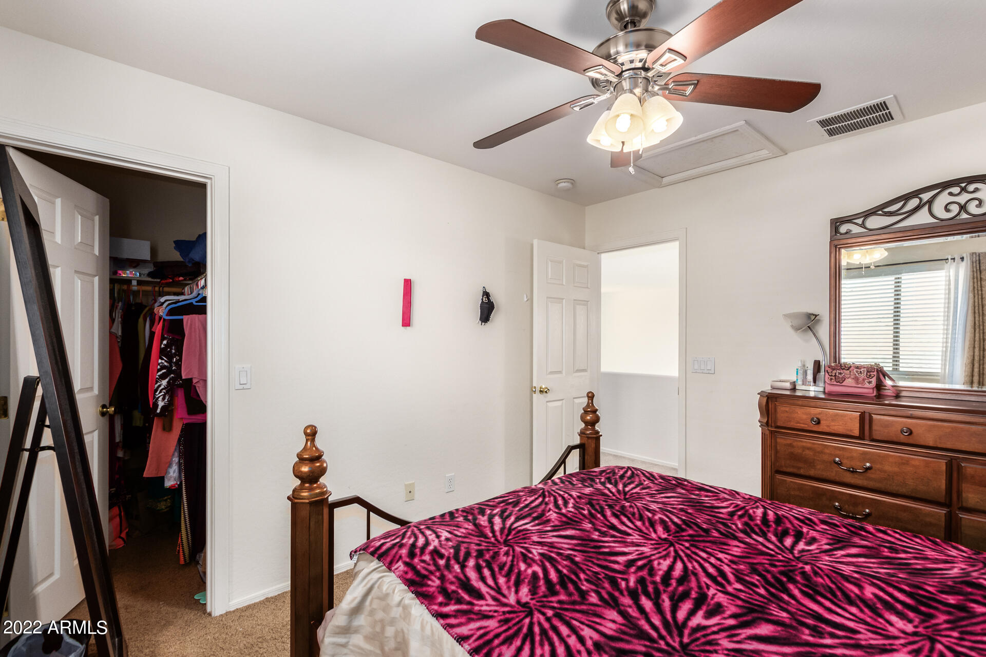 3790 West South Butte Road Queen Creek, AZ 85144 - Photo 26 of 40 a bedroom with a bed and a chandelier