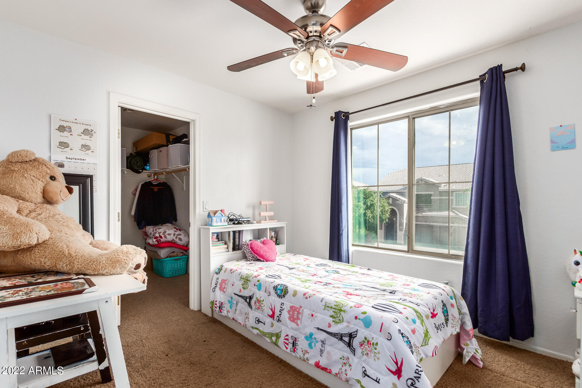 3790 West South Butte Road Queen Creek, AZ 85144 - Photo 28 of 40 a bedroom with a bed and a chandelier