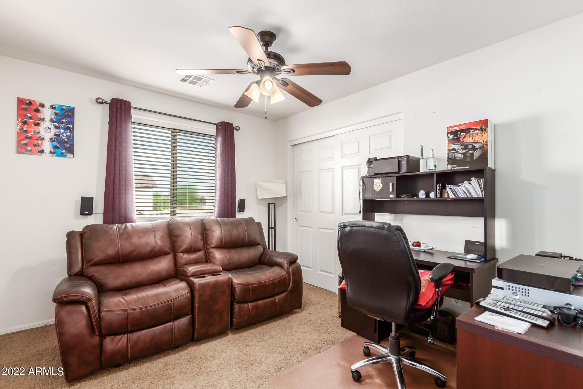 3790 West South Butte Road Queen Creek, AZ 85144 - Photo 30 of 40 a livingroom with workspace and a couch