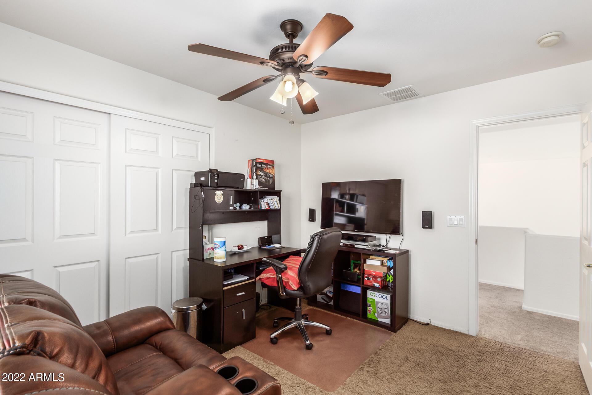 3790 West South Butte Road Queen Creek, AZ 85144 - Photo 31 of 40 a living room with furniture and a flat screen tv