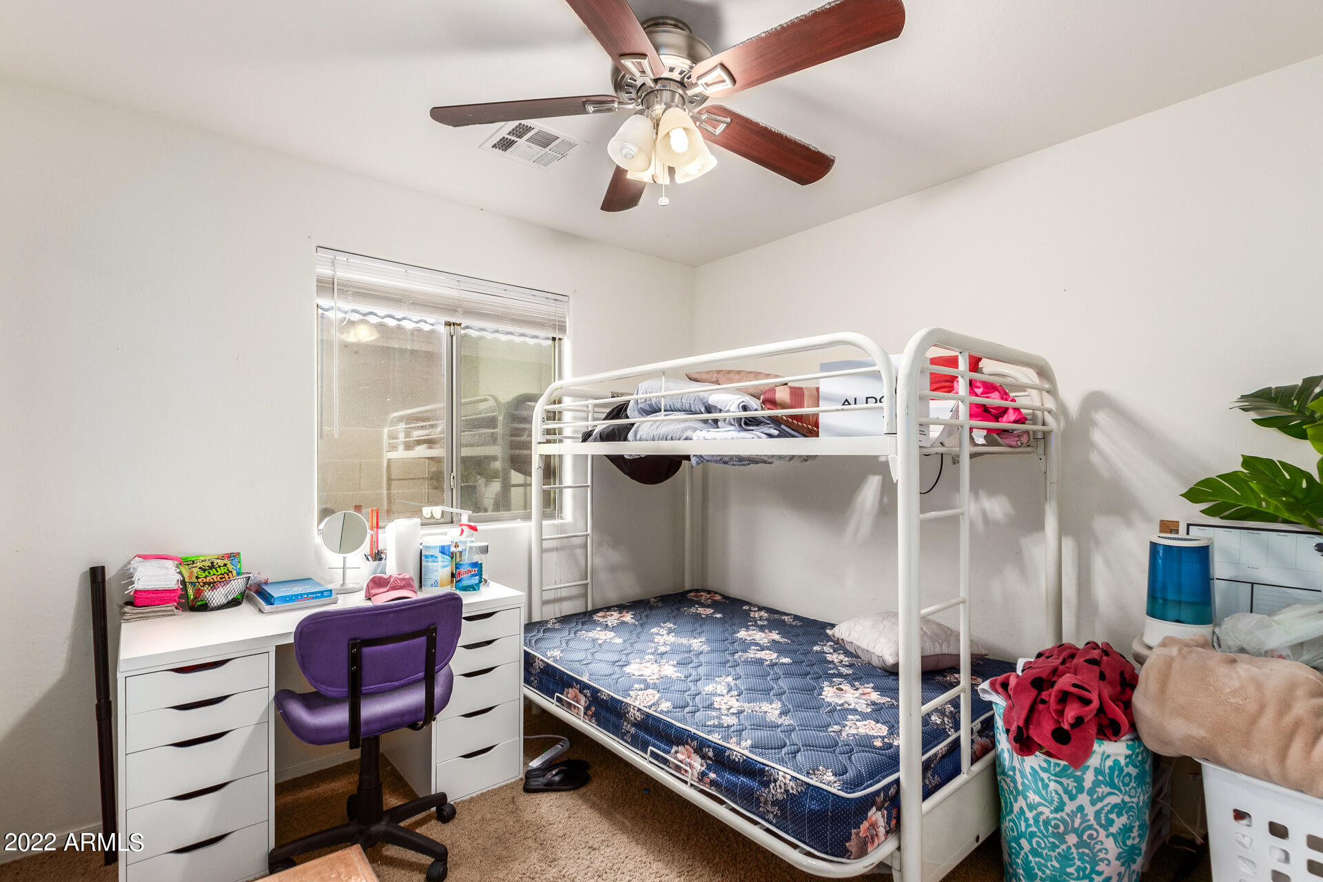 3790 West South Butte Road Queen Creek, AZ 85144 - Photo 32 of 40 a bedroom with a bed and a chandelier