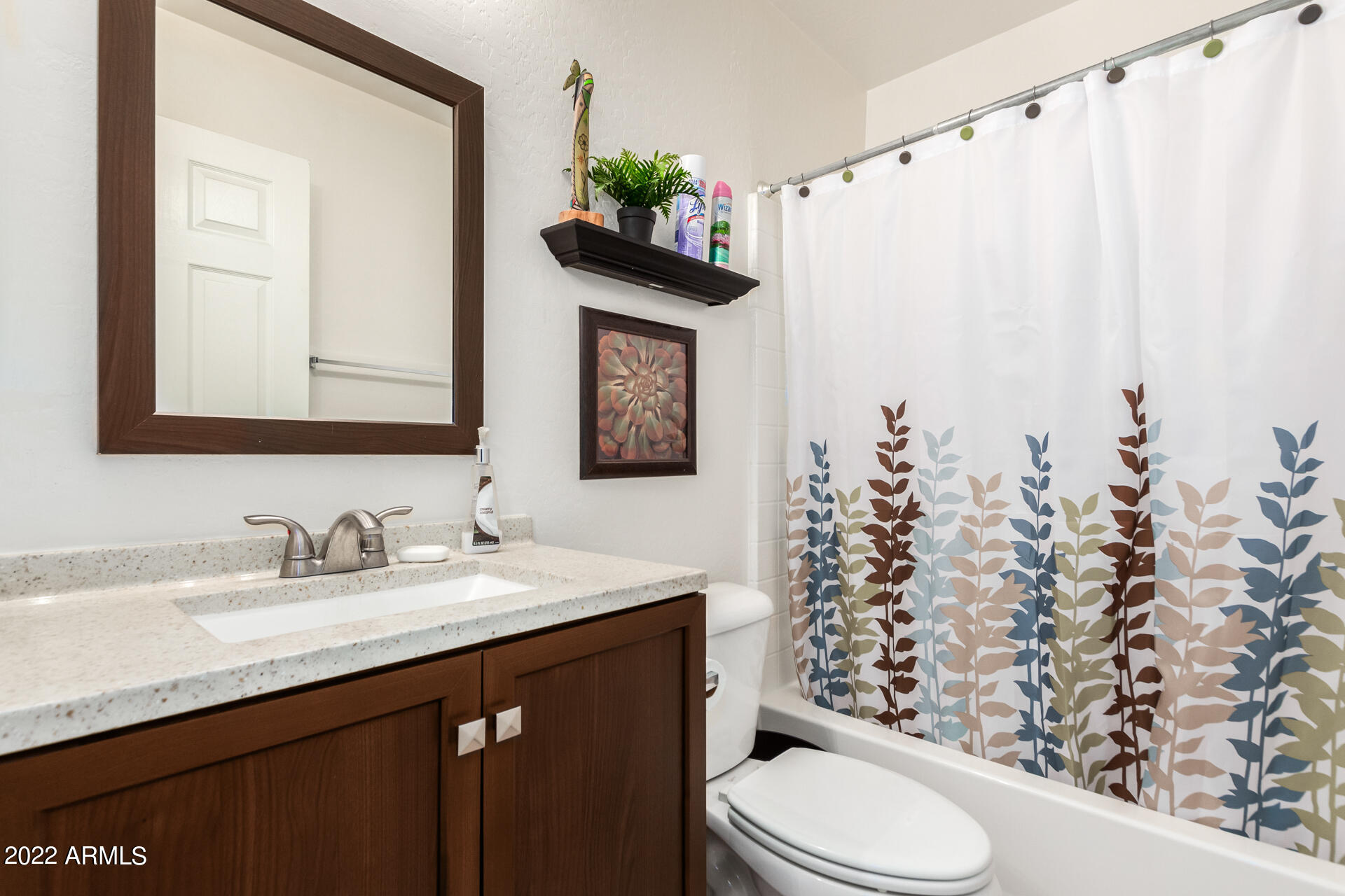 3790 West South Butte Road Queen Creek, AZ 85144 - Photo 34 of 40 a bathroom with a sink vanity mirror and toilet