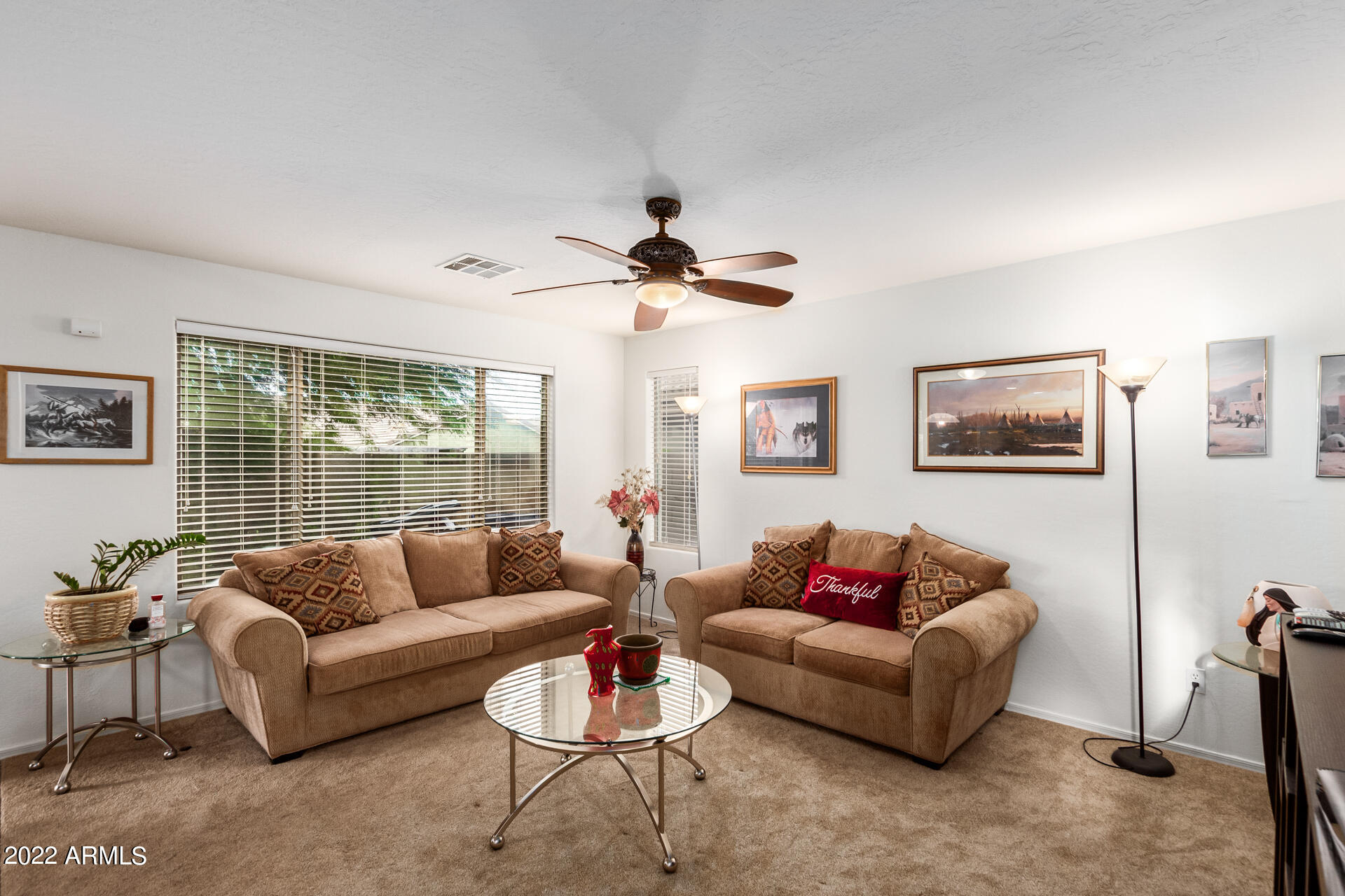 3790 West South Butte Road Queen Creek, AZ 85144 - Photo 8 of 40 a living room with furniture and a large window