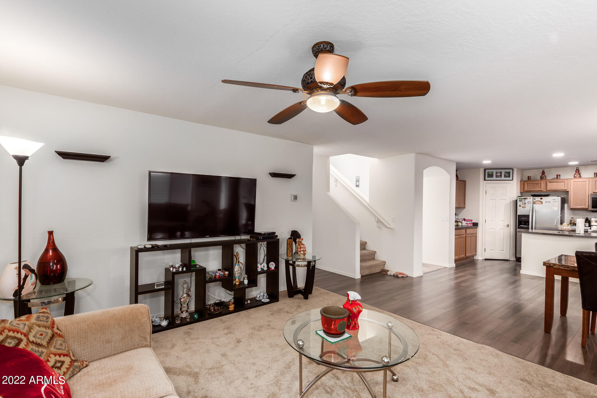 3790 West South Butte Road Queen Creek, AZ 85144 - Photo 10 of 40 a living room with furniture and a flat screen tv