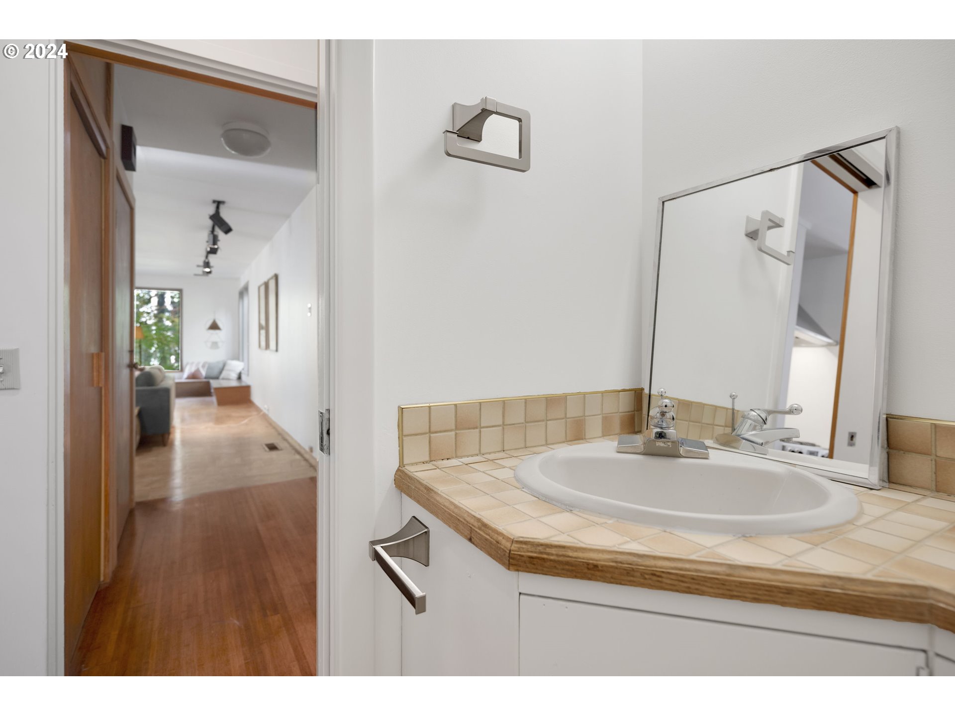 3901 Southwest Hamilton Street Portland, OR 97221 - Photo 14 of 38 a bathroom with a sink and a mirror
