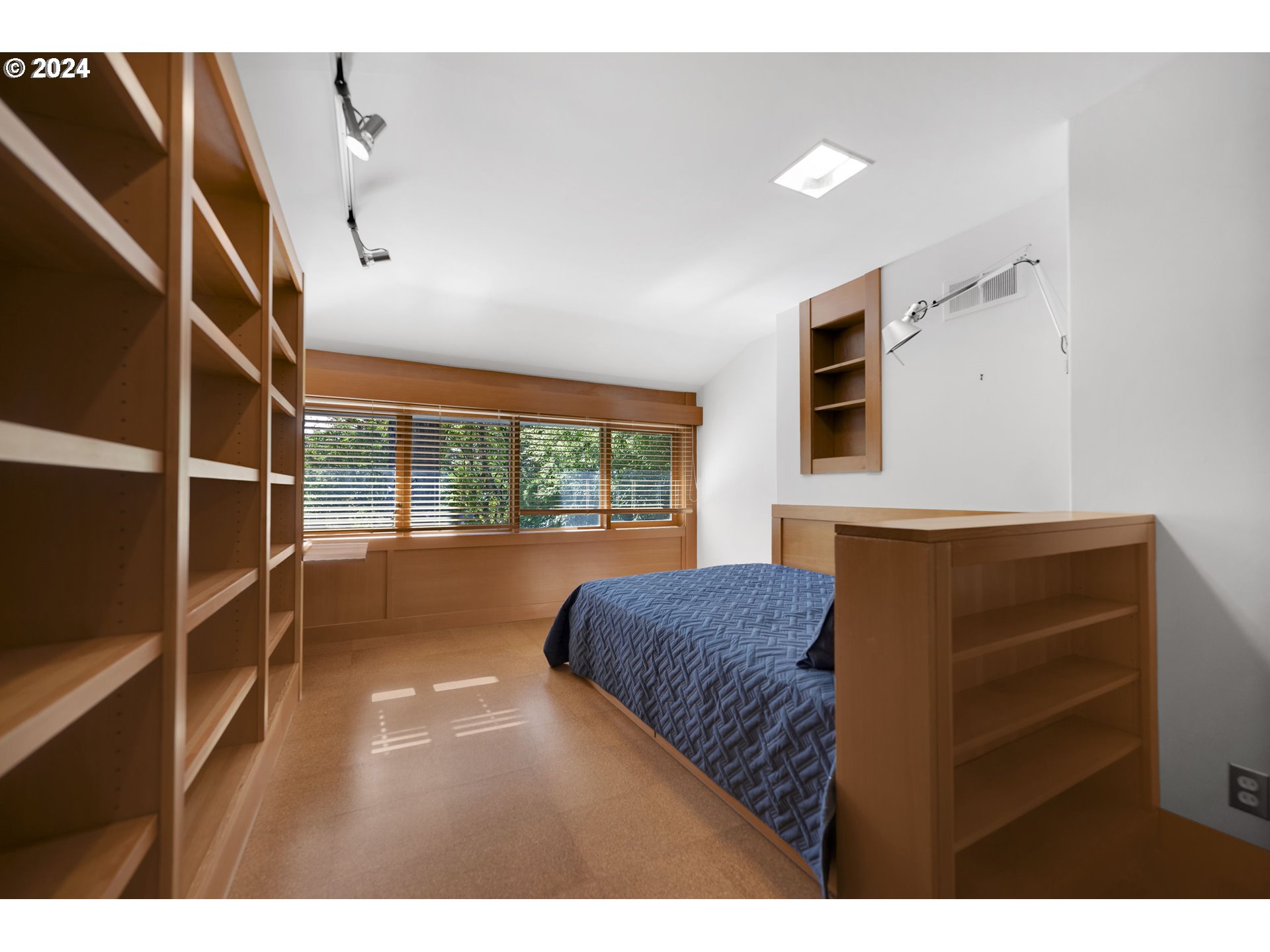 3901 Southwest Hamilton Street Portland, OR 97221 - Photo 23 of 38 a bedroom with a bed and a large window