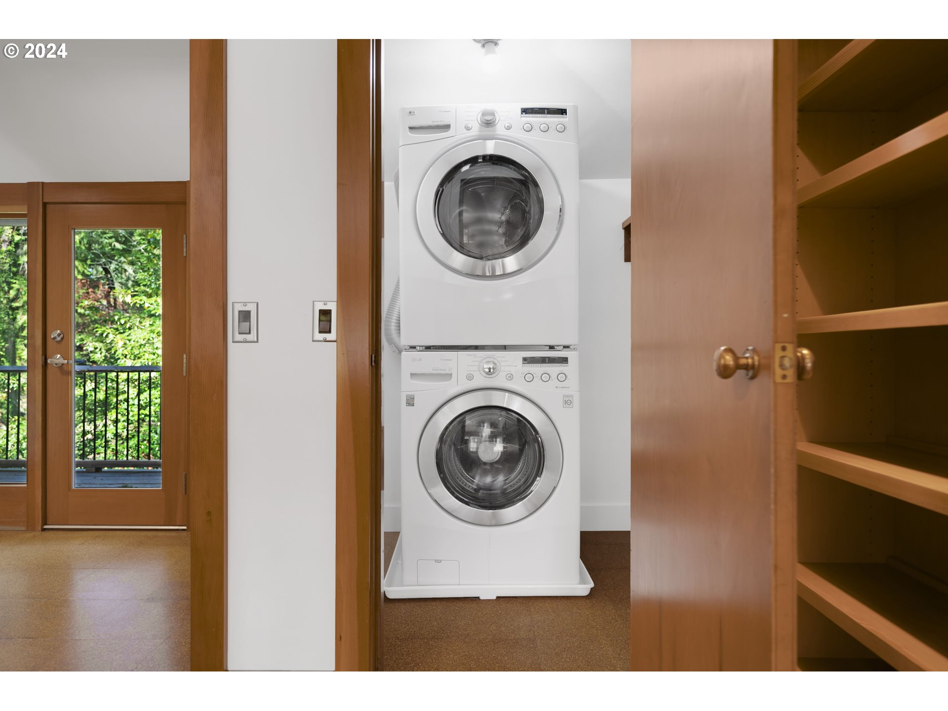3901 Southwest Hamilton Street Portland, OR 97221 - Photo 24 of 38 a view of a hallway with washer and dryer