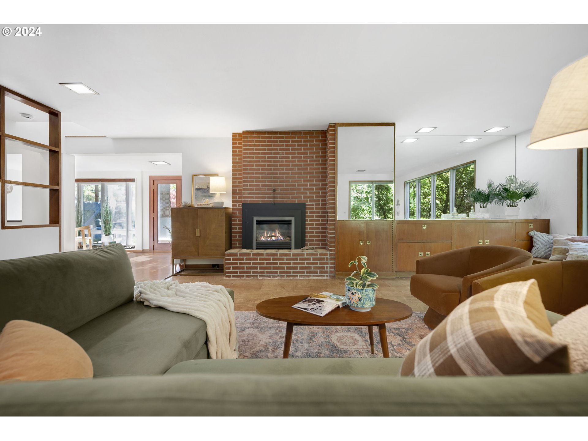 3901 Southwest Hamilton Street Portland, OR 97221 - Photo 4 of 38 a living room with furniture and a fireplace