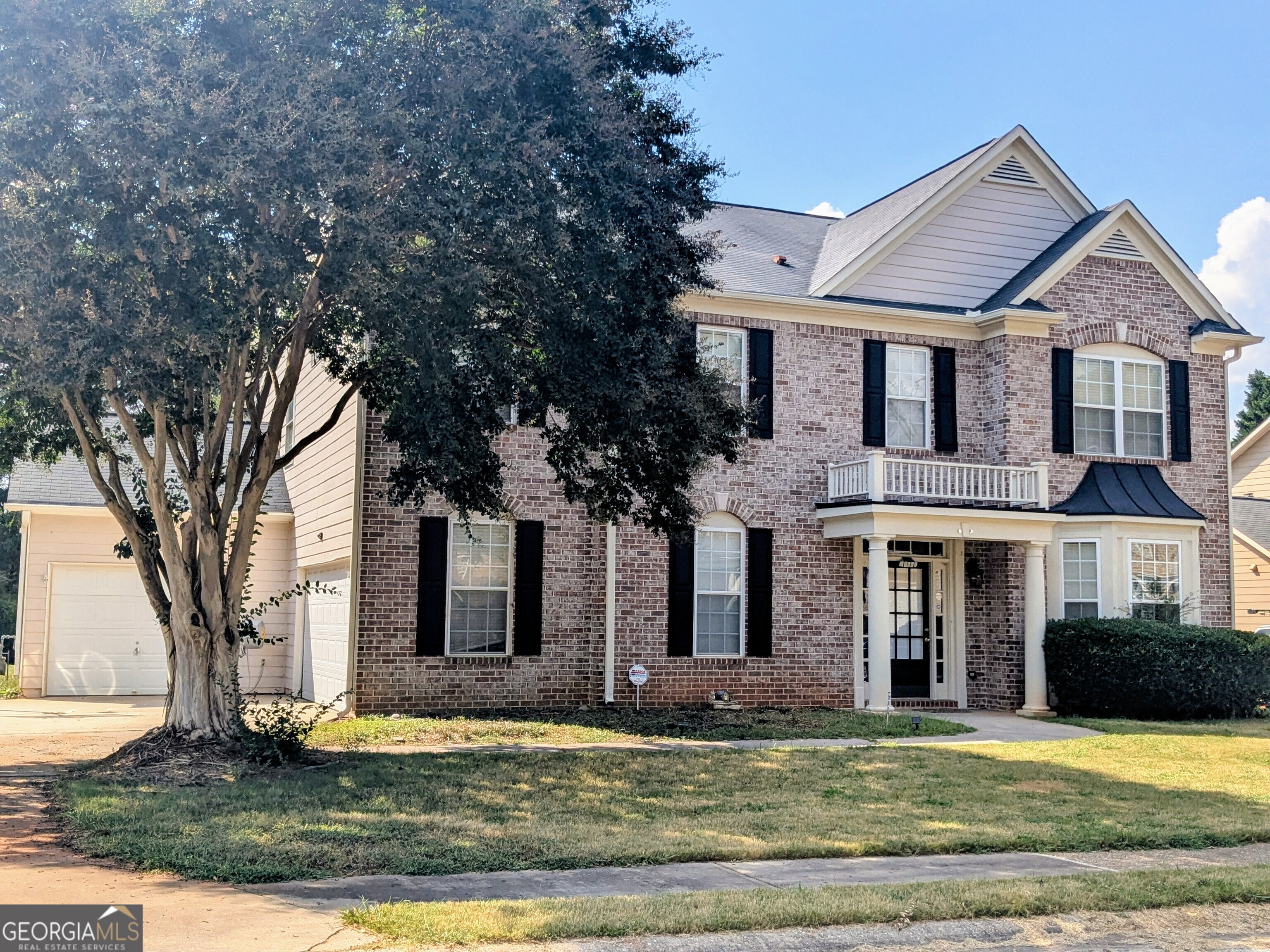 137 Village Green Circle Tyrone, GA 30290 - Photo 1 of 30 a front view of a house with a yard