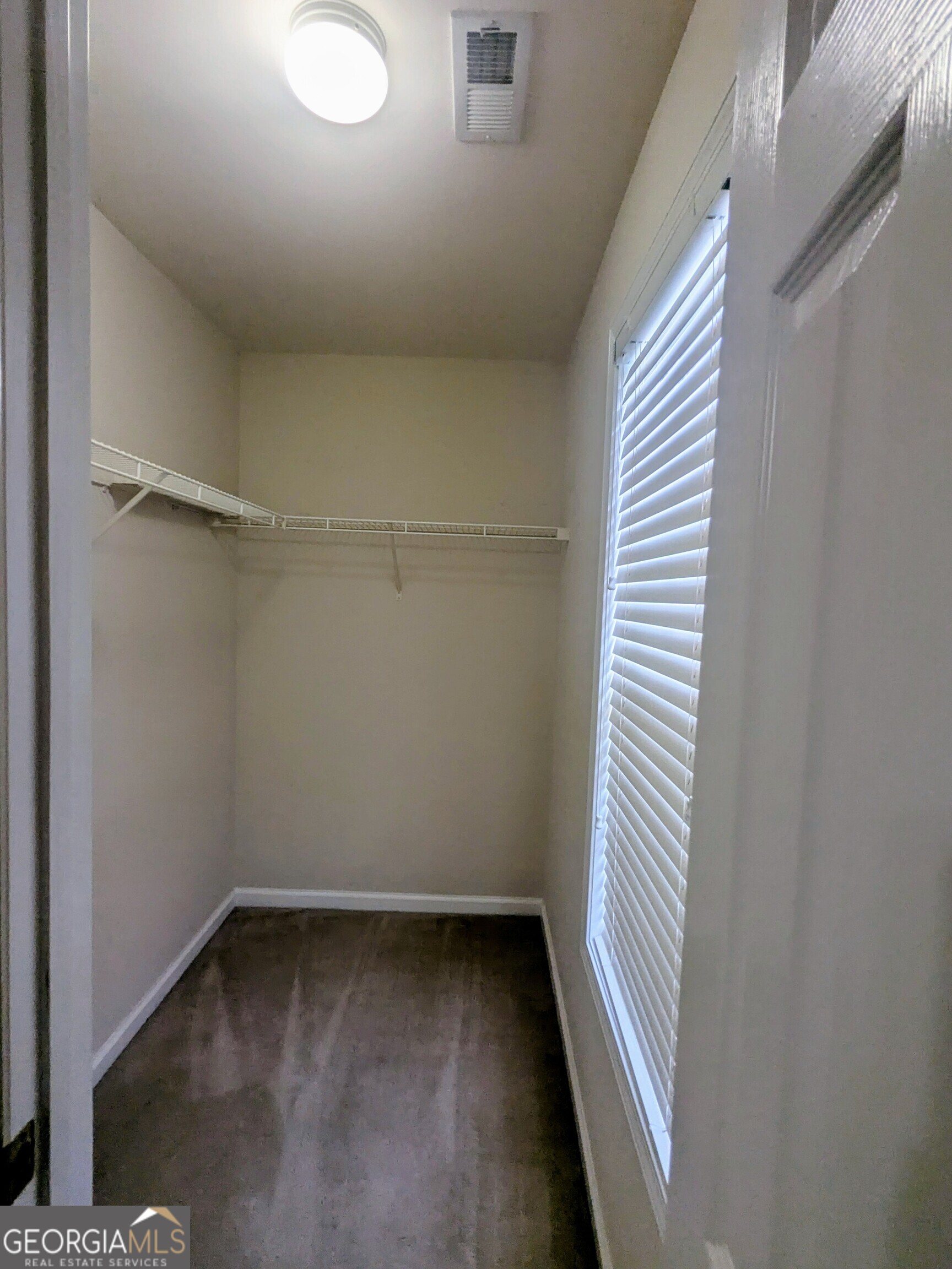 137 Village Green Circle Tyrone, GA 30290 - Photo 16 of 30 a view of a room with a window