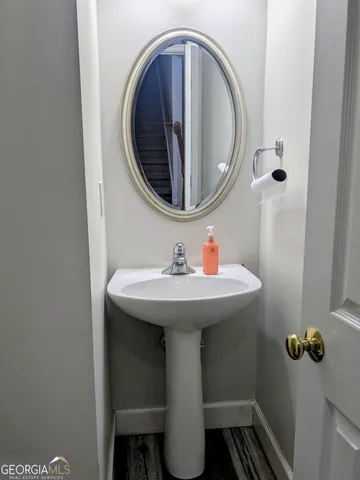 a bathroom with a sink and mirror