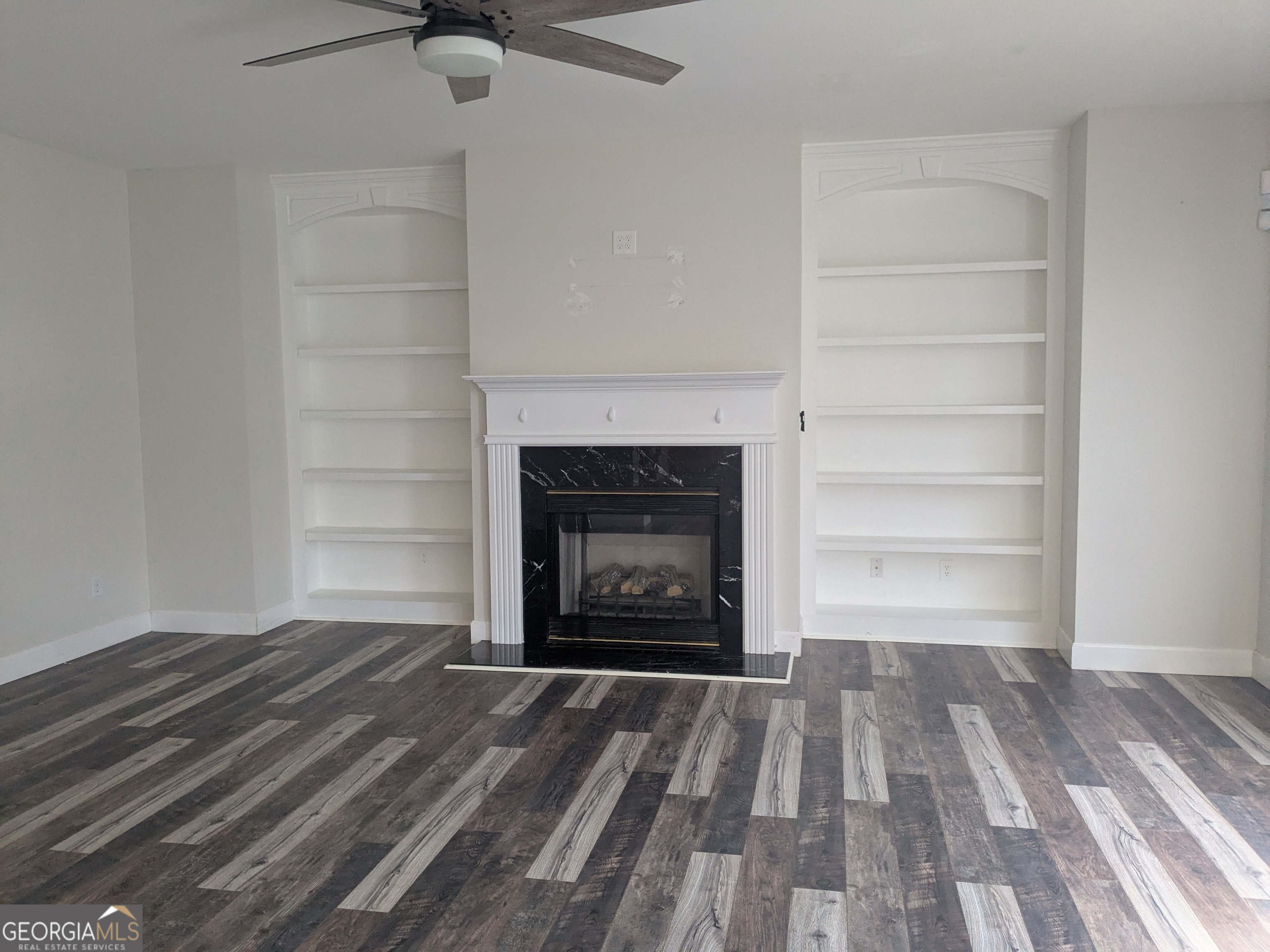 137 Village Green Circle Tyrone, GA 30290 - Photo 10 of 30 a room with a fireplace