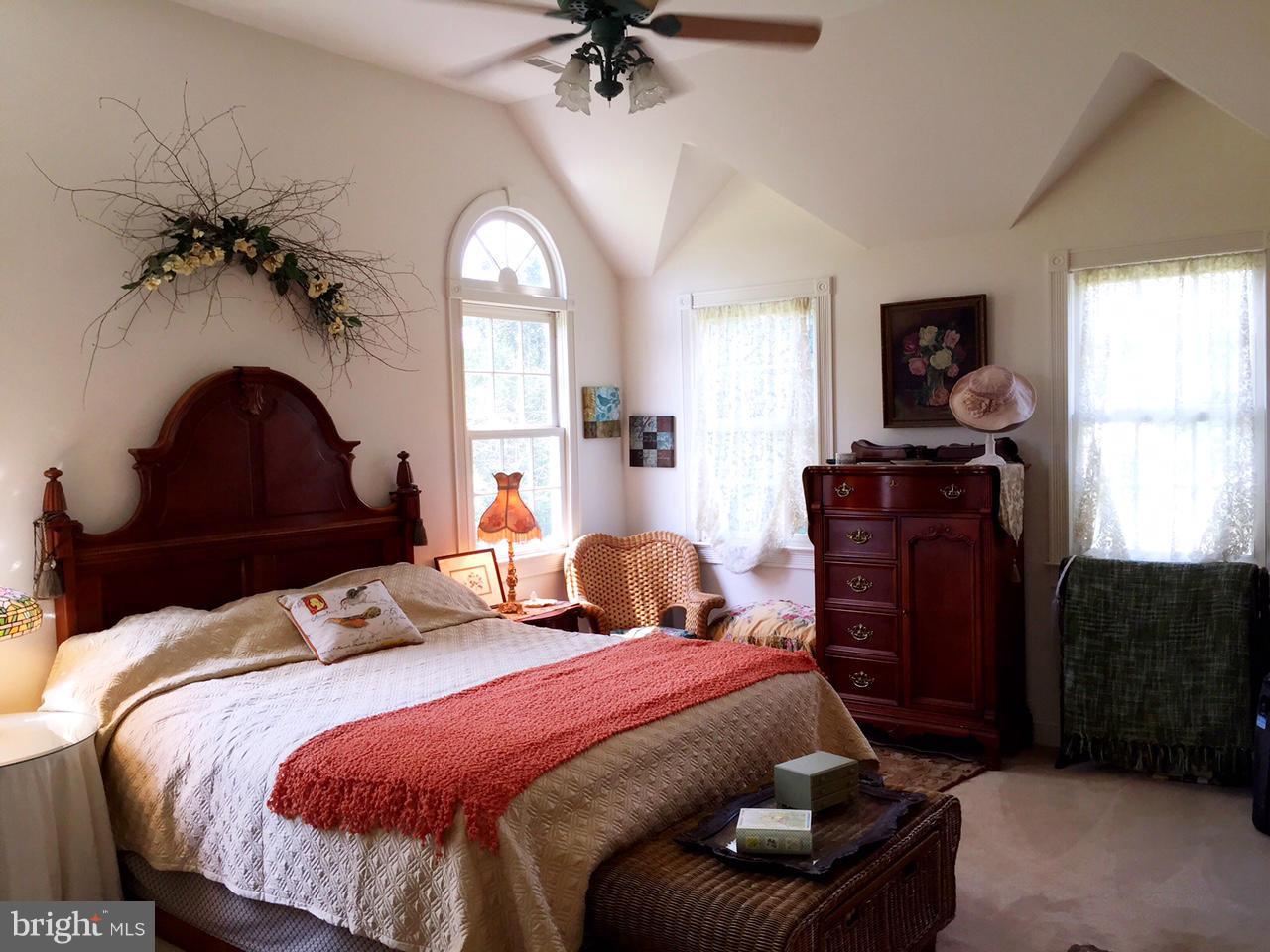 5407 Sumerduck Road Sumerduck, VA 22742 - Photo 27 of 30 a bedroom with a bed and a chandelier