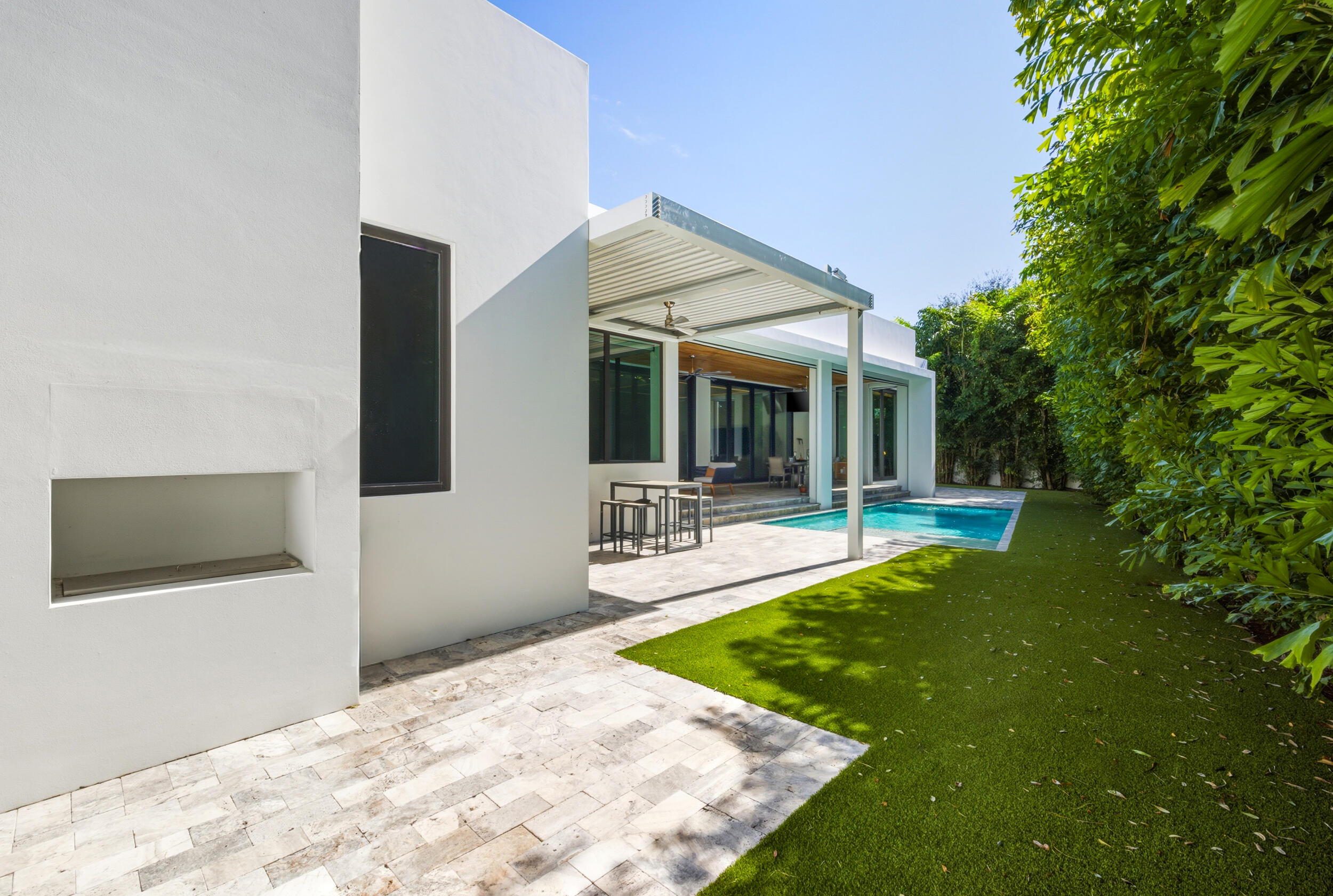 10 Coconut Road Delray Beach, FL 33444 - Photo 27 of 41 a view of a house with swimming pool and sitting area