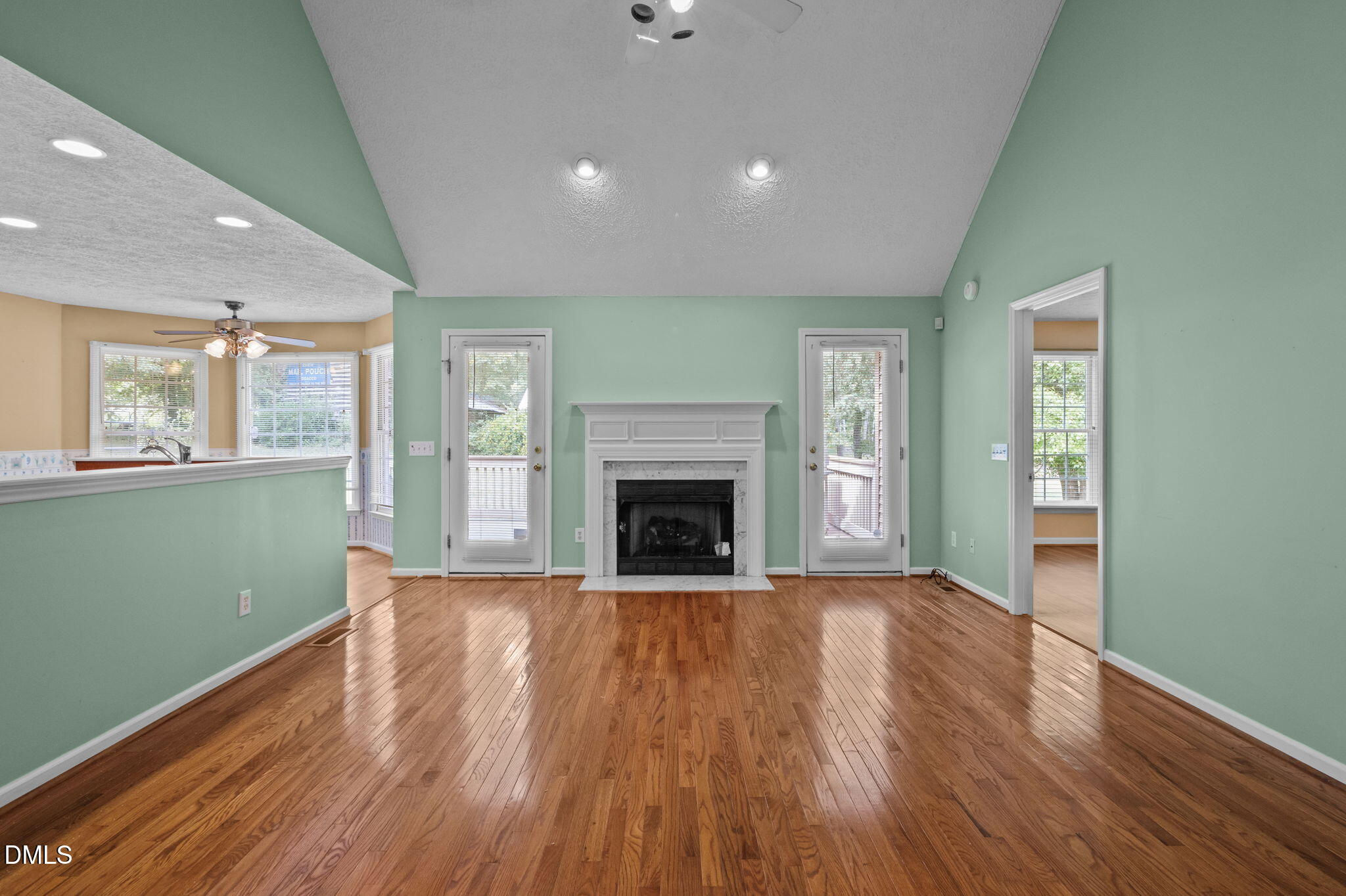 25 Poplar Lane Roxboro, NC 27574 - Photo 20 of 41 a view of an empty room with wooden floor fireplace and a window