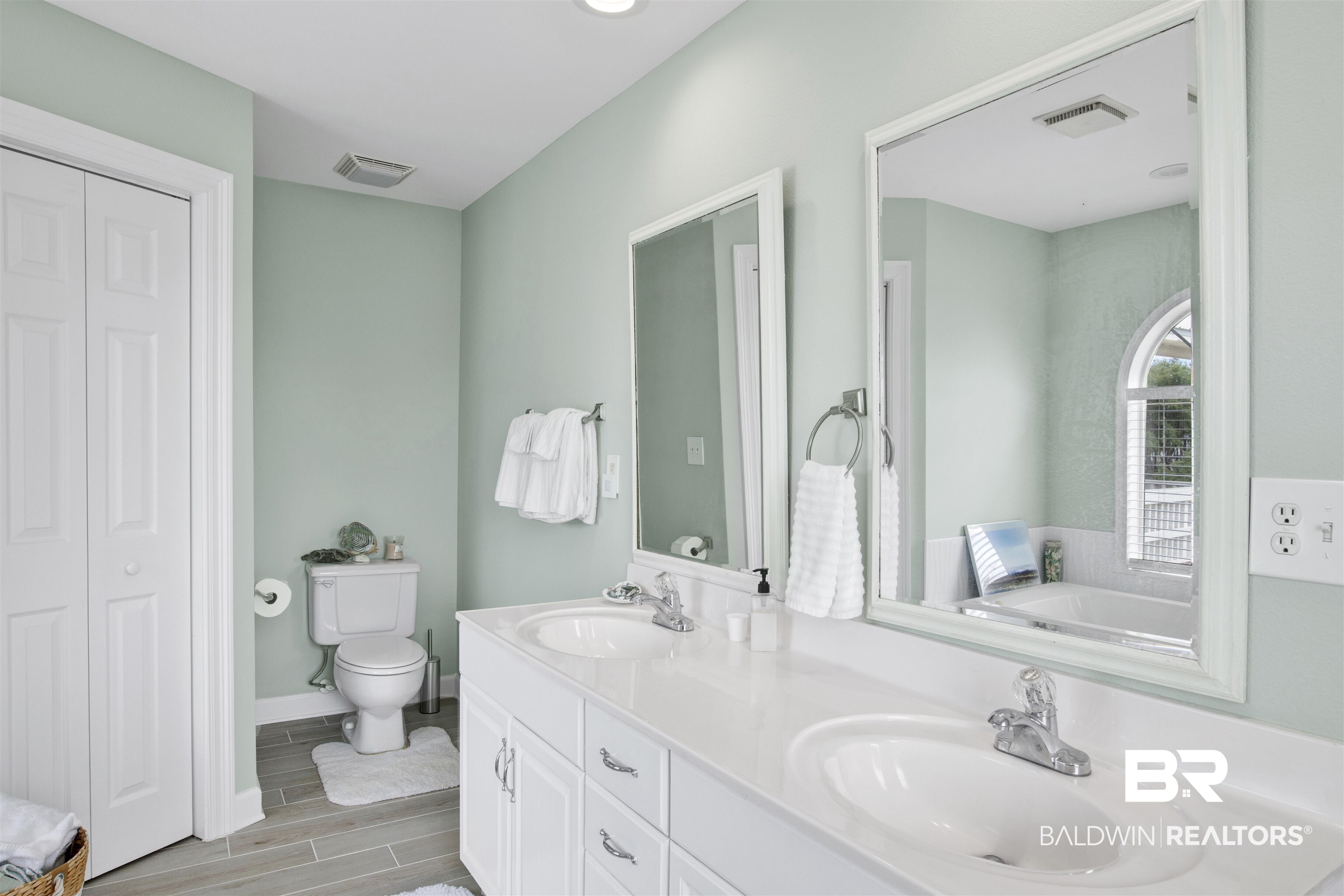 33093 River Road Orange Beach, AL 36561 - Photo 15 of 30 Bathroom with dual vanity, toilet, and a bathtub