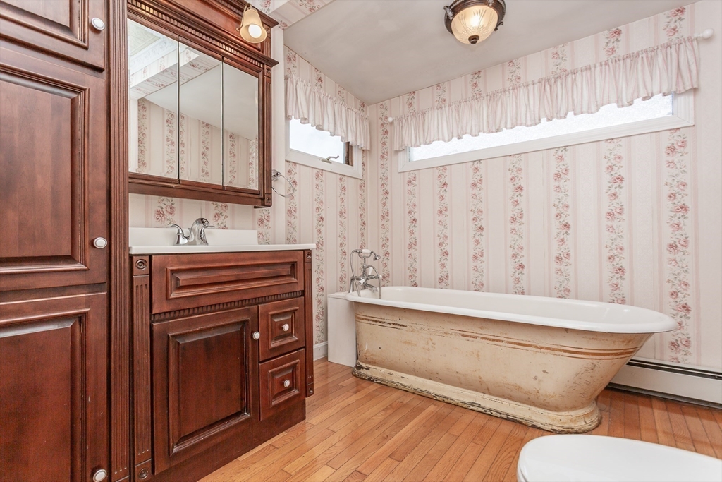 724 High Street Fall River, MA 02720 - Photo 16 of 39 a bathroom with a bathtub sink and toilet