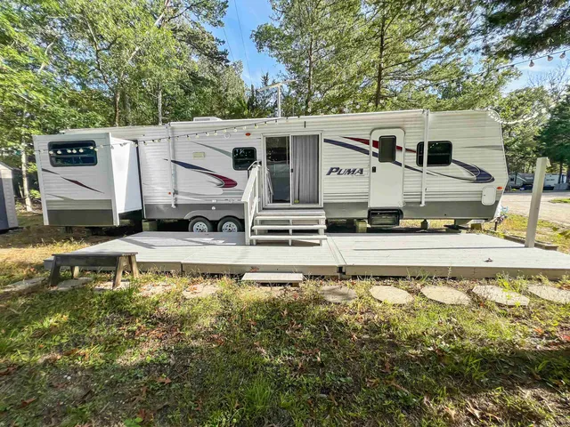a view of a house with wooden fence