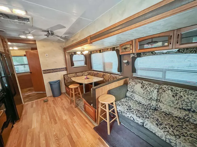 a kitchen with stainless steel appliances granite countertop a sink and wooden cabinets